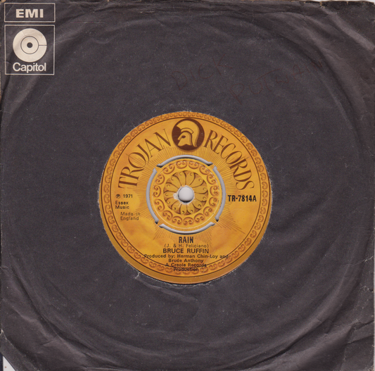 Record label with Trojan Records logo and EMI Capitol branding on a dark background