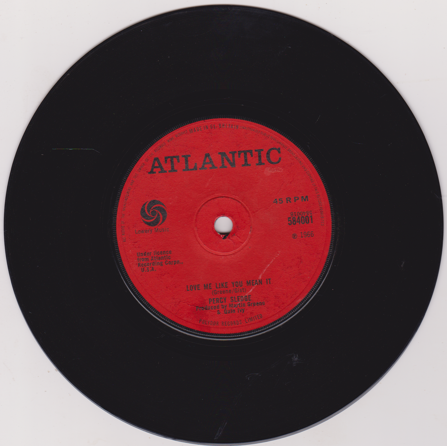 Vinyl record with a red label featuring the Atlantic Records logo on a white background