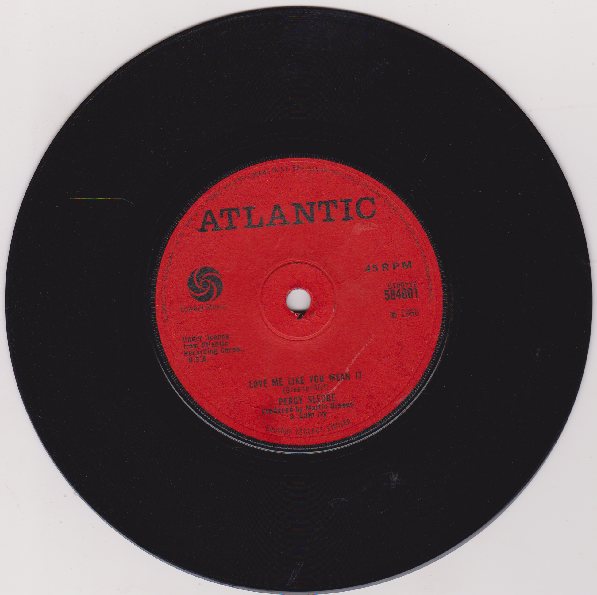 Vinyl record with a red label featuring the Atlantic Records logo on a white background