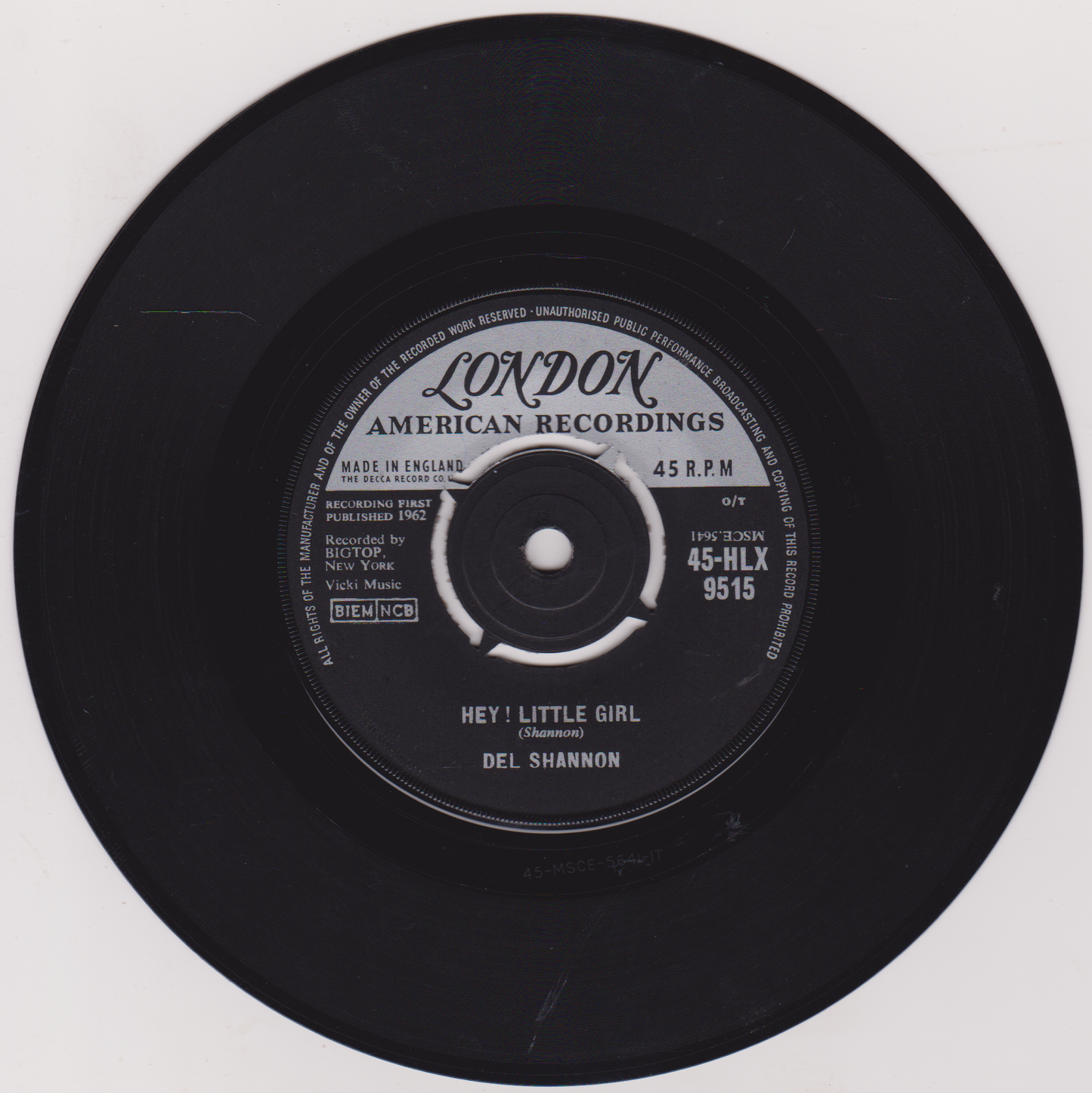 Black vinyl record with 'London American Recordings' label on a white background
