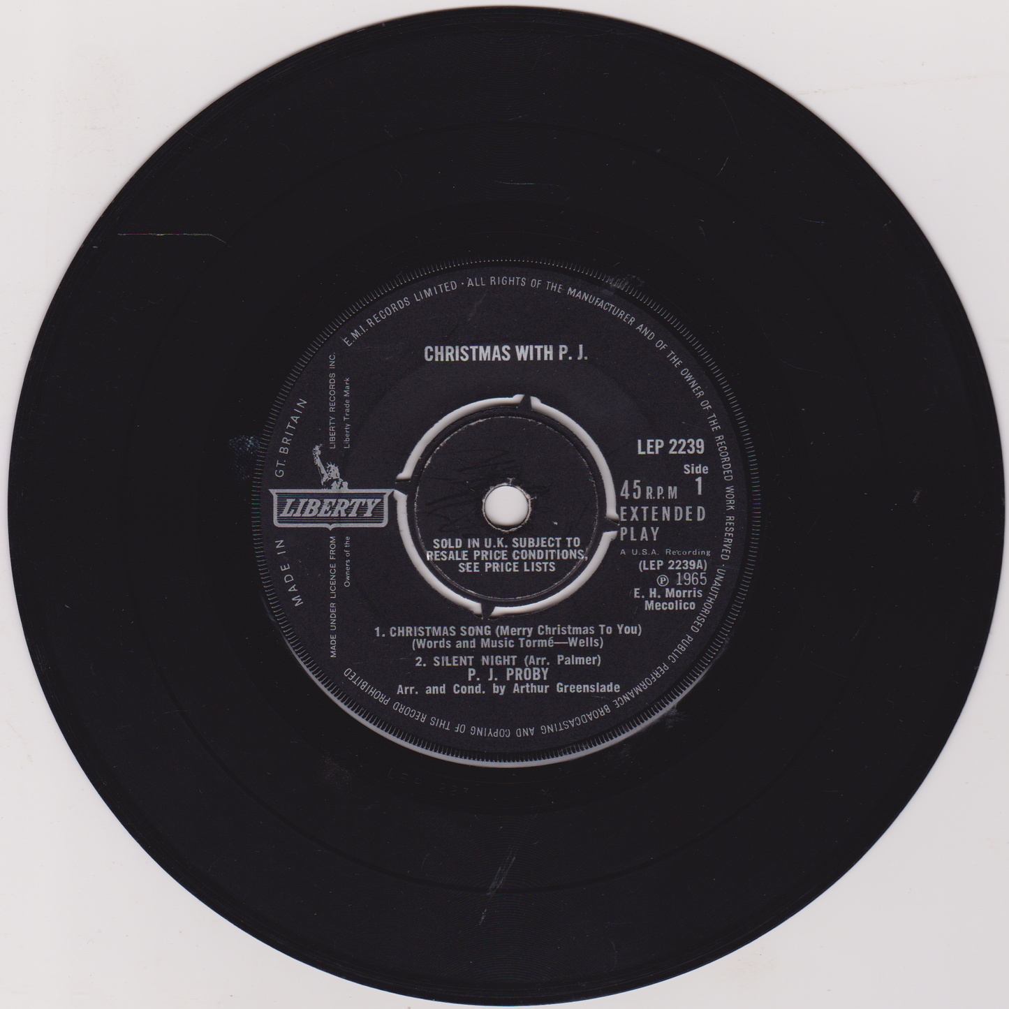 Black vinyl record with label on a white background