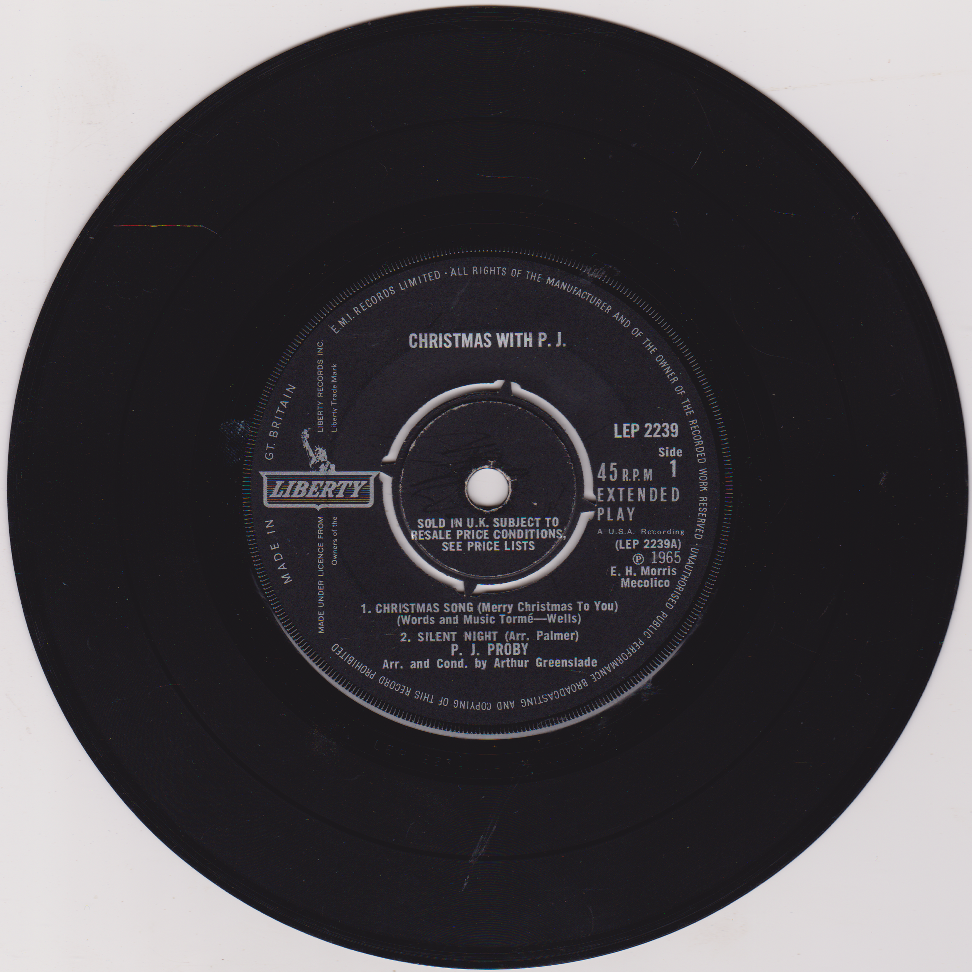 Black vinyl record with label on a white background