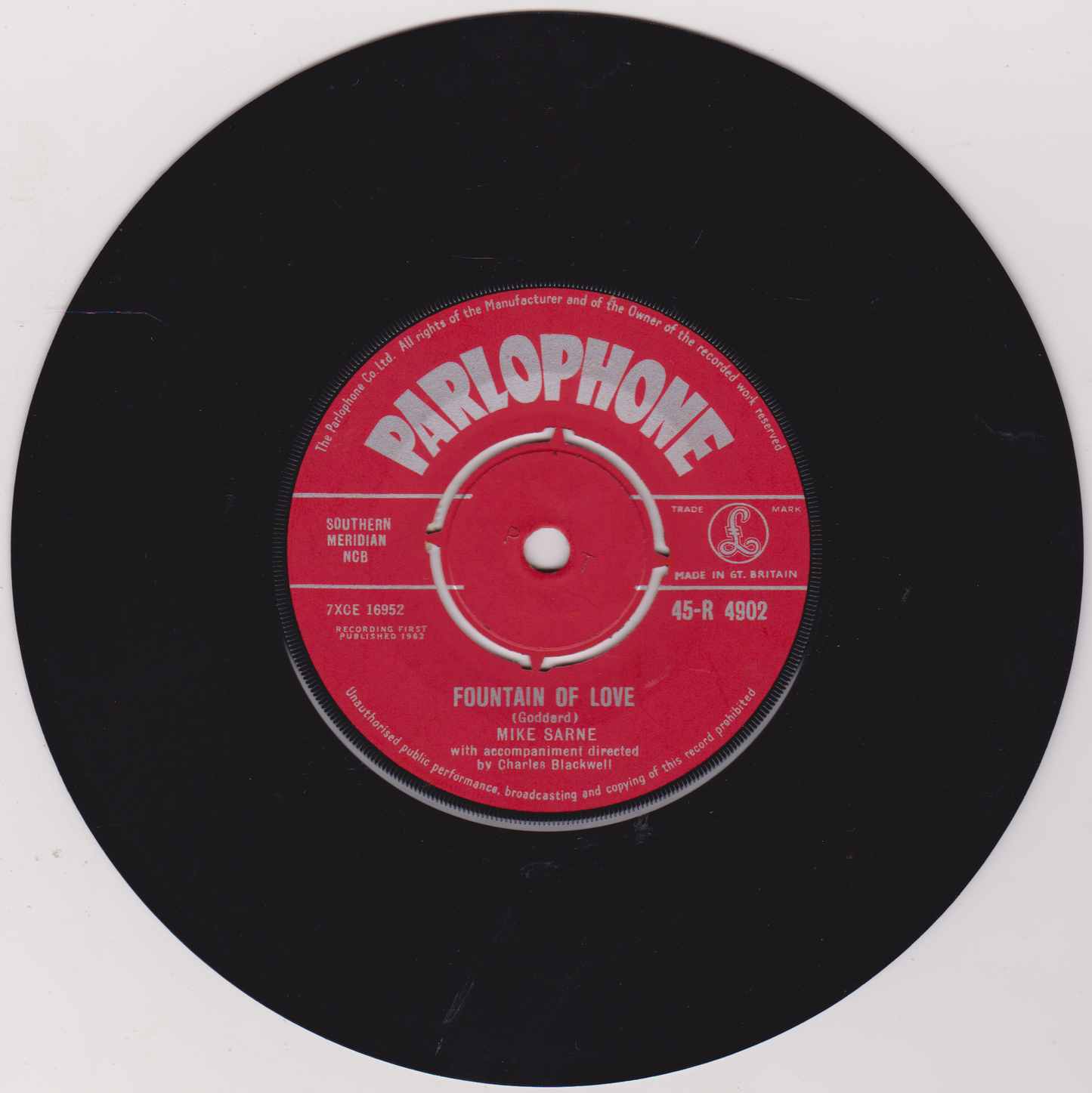 Parlophone record label on a black vinyl record with red label