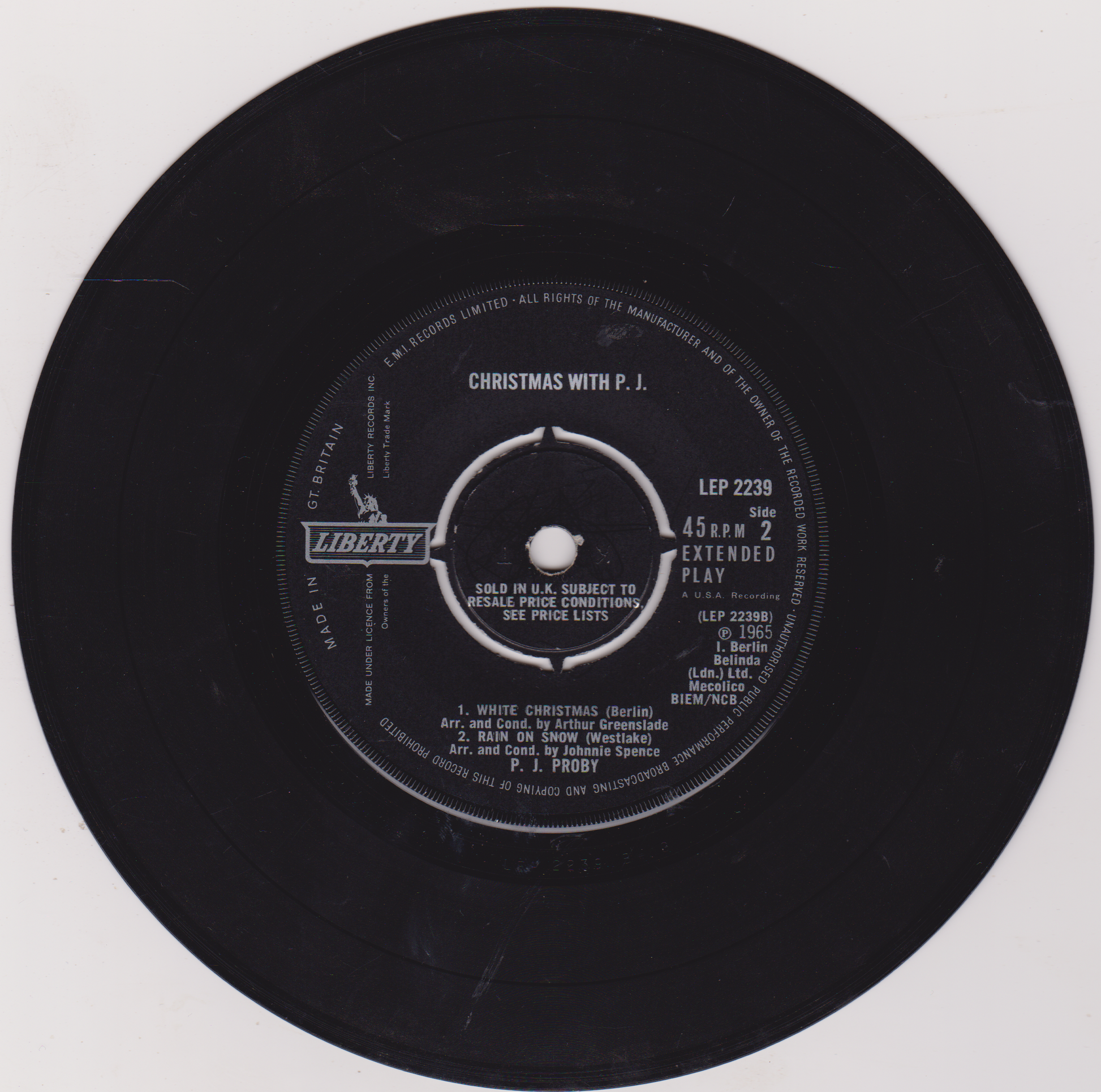 Vinyl record label with text and branding on a white background