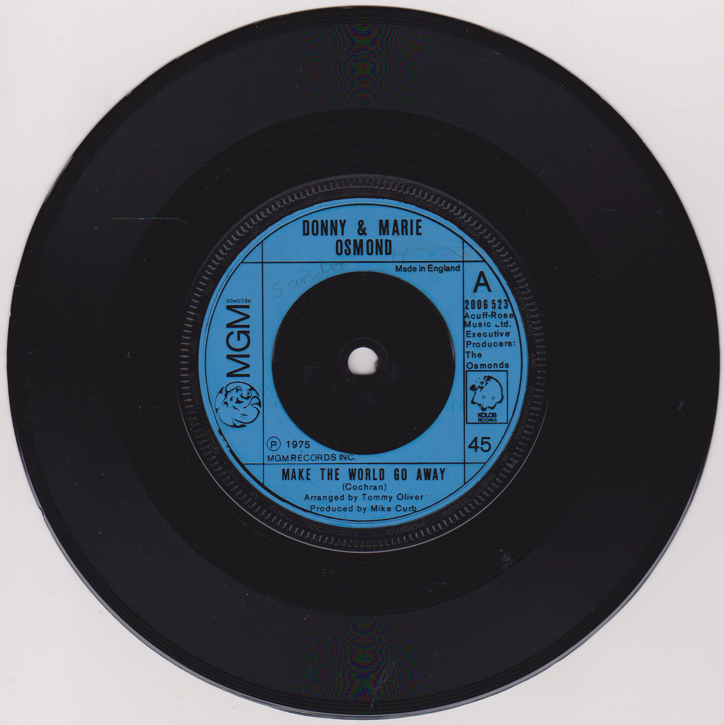 Vinyl record with blue label featuring 'Donny & Marie Osmond' on a white background