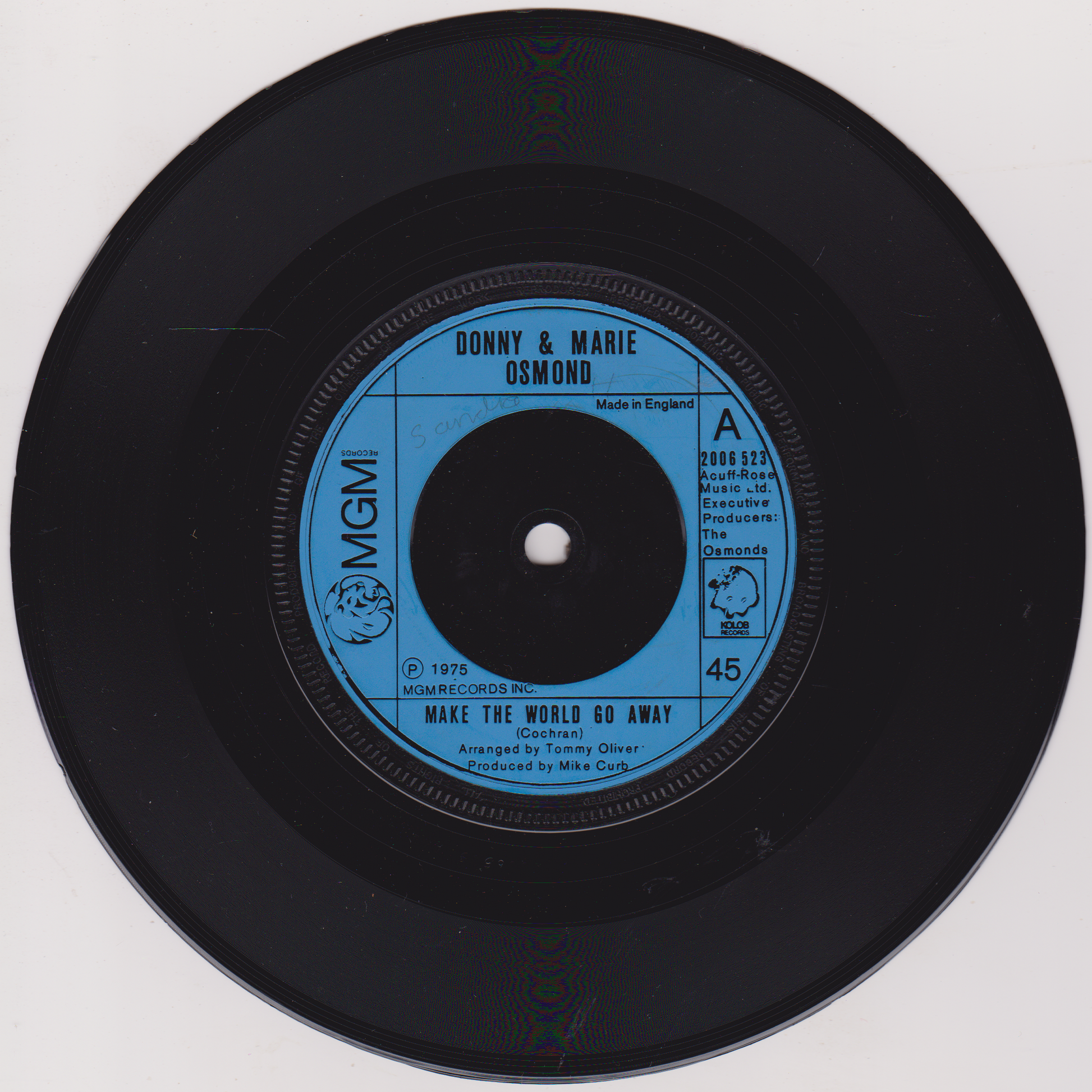 Vinyl record with blue label featuring 'Donny & Marie Osmond' on a white background