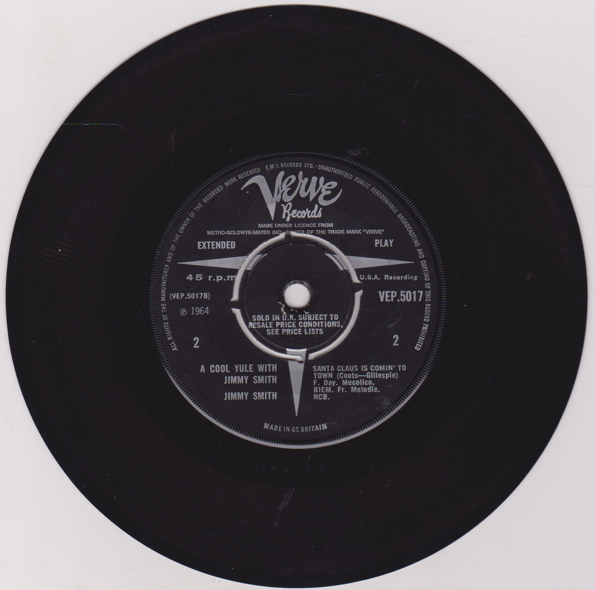 Black vinyl record with Verve Records label on a white background