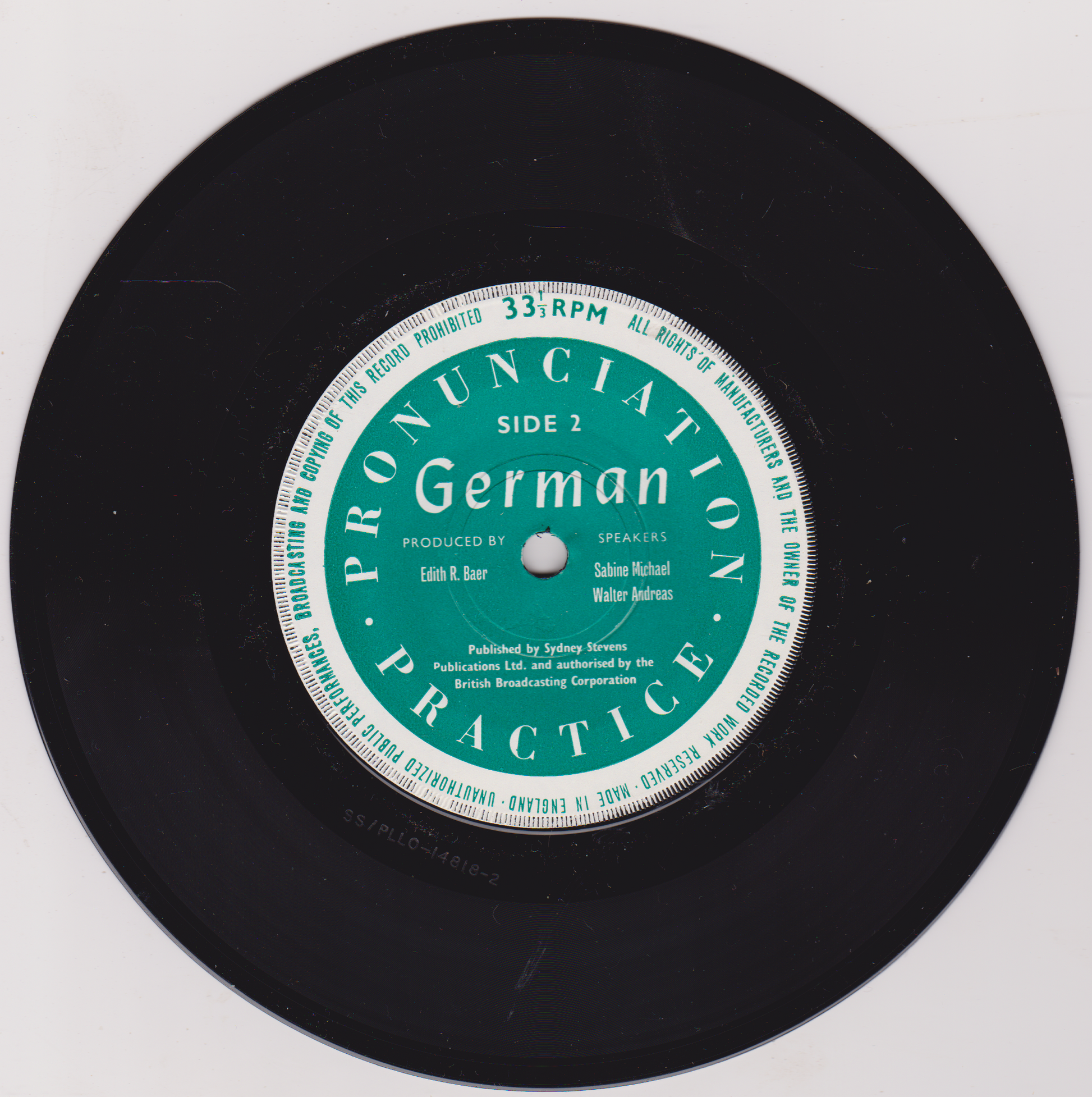 Black vinyl record with a green label titled 'Pronunciation Practice German' on a white background