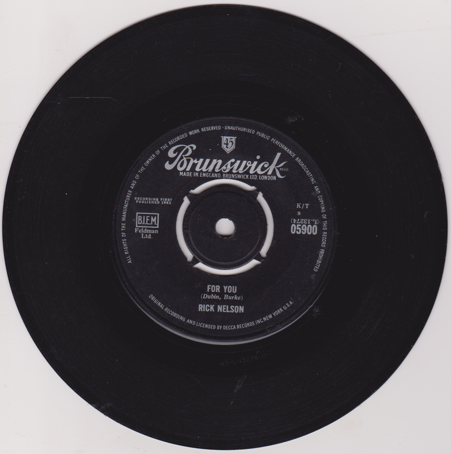 Black vinyl record with Brunswick label on a white background