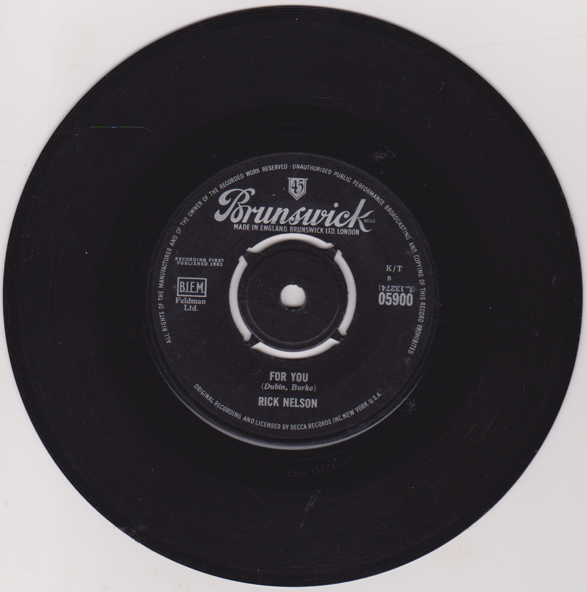 Black vinyl record with Brunswick label on a white background