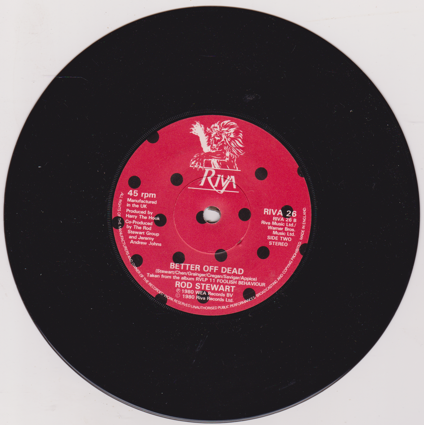 Vinyl record with a red label featuring text and a logo on a white background