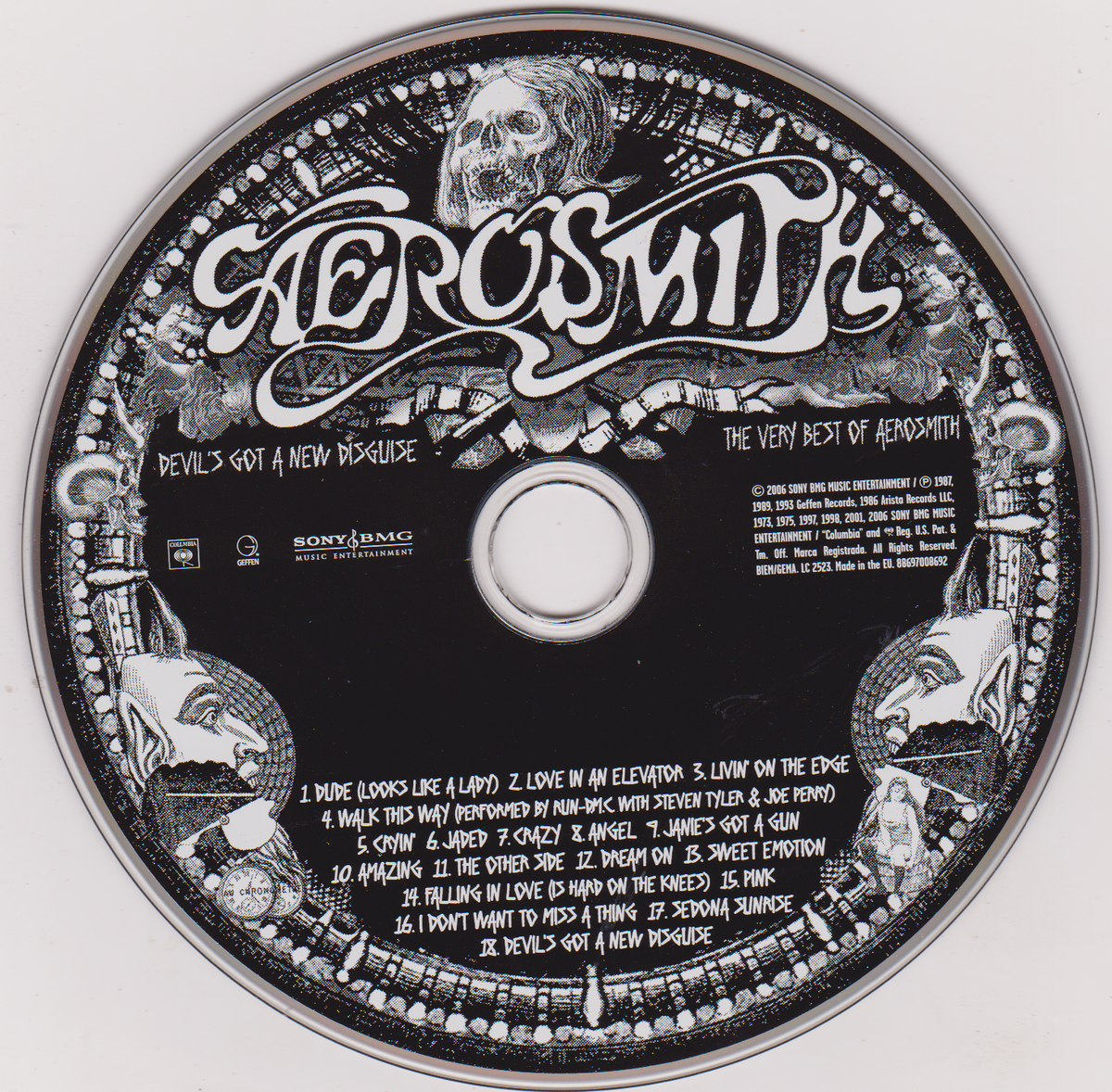 A circular black-and-white album disc for Aerosmith's 'Devil's Got a New Hideout' with the band's name in large stylized lettering and track listing text on a plain white background.