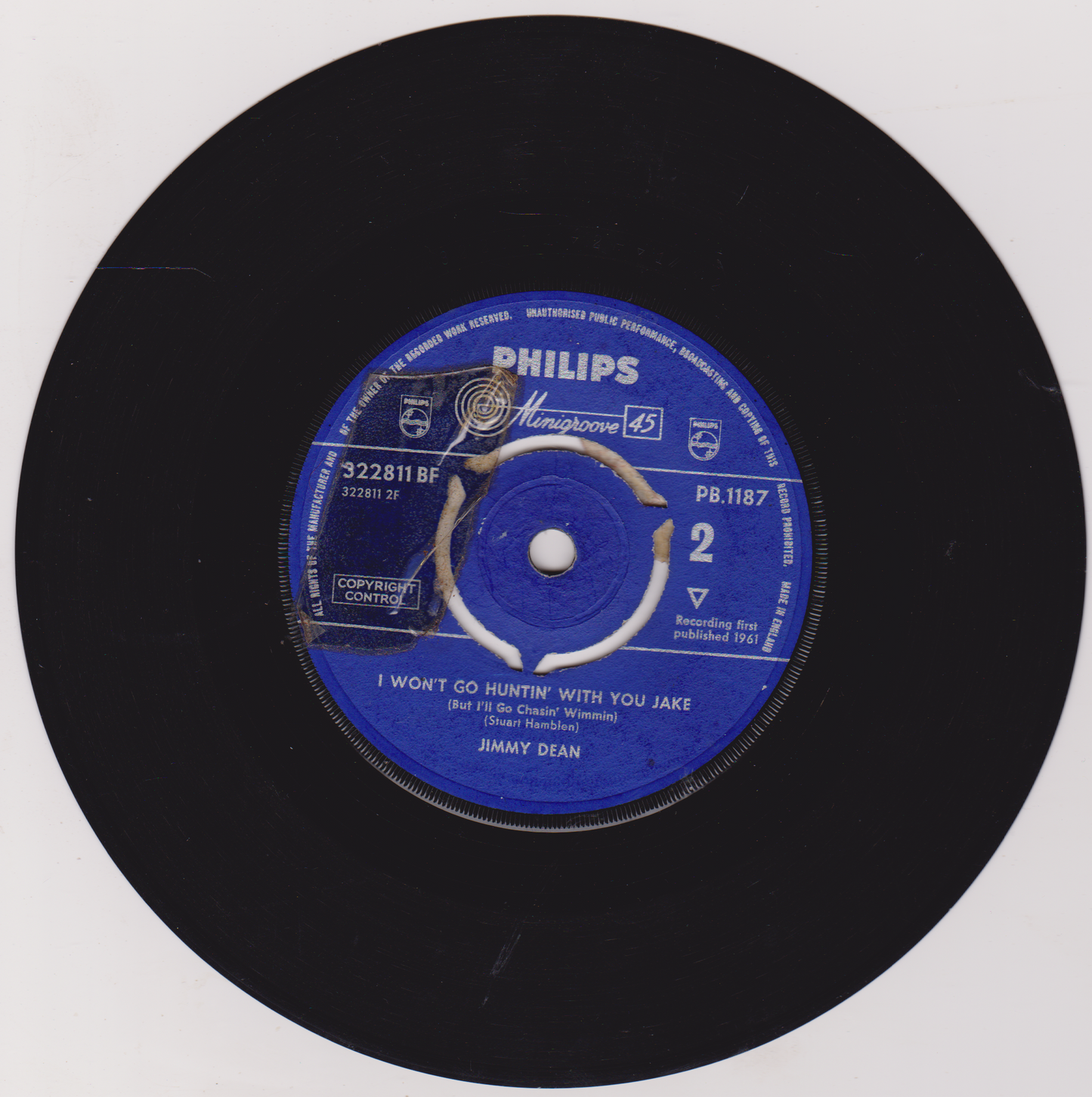 Vinyl record with blue label featuring 'Philips' branding and song details.