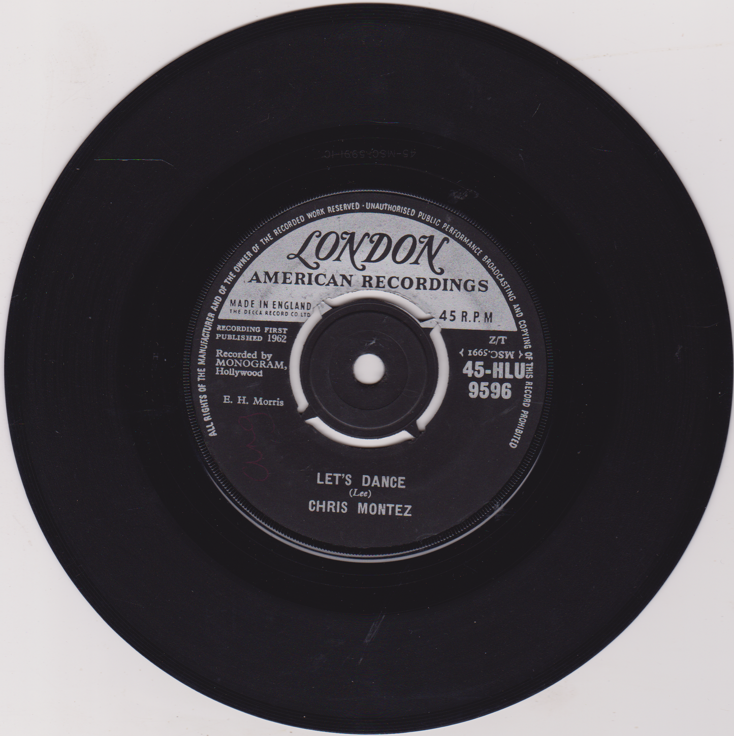 Black vinyl record with a label on a white background
