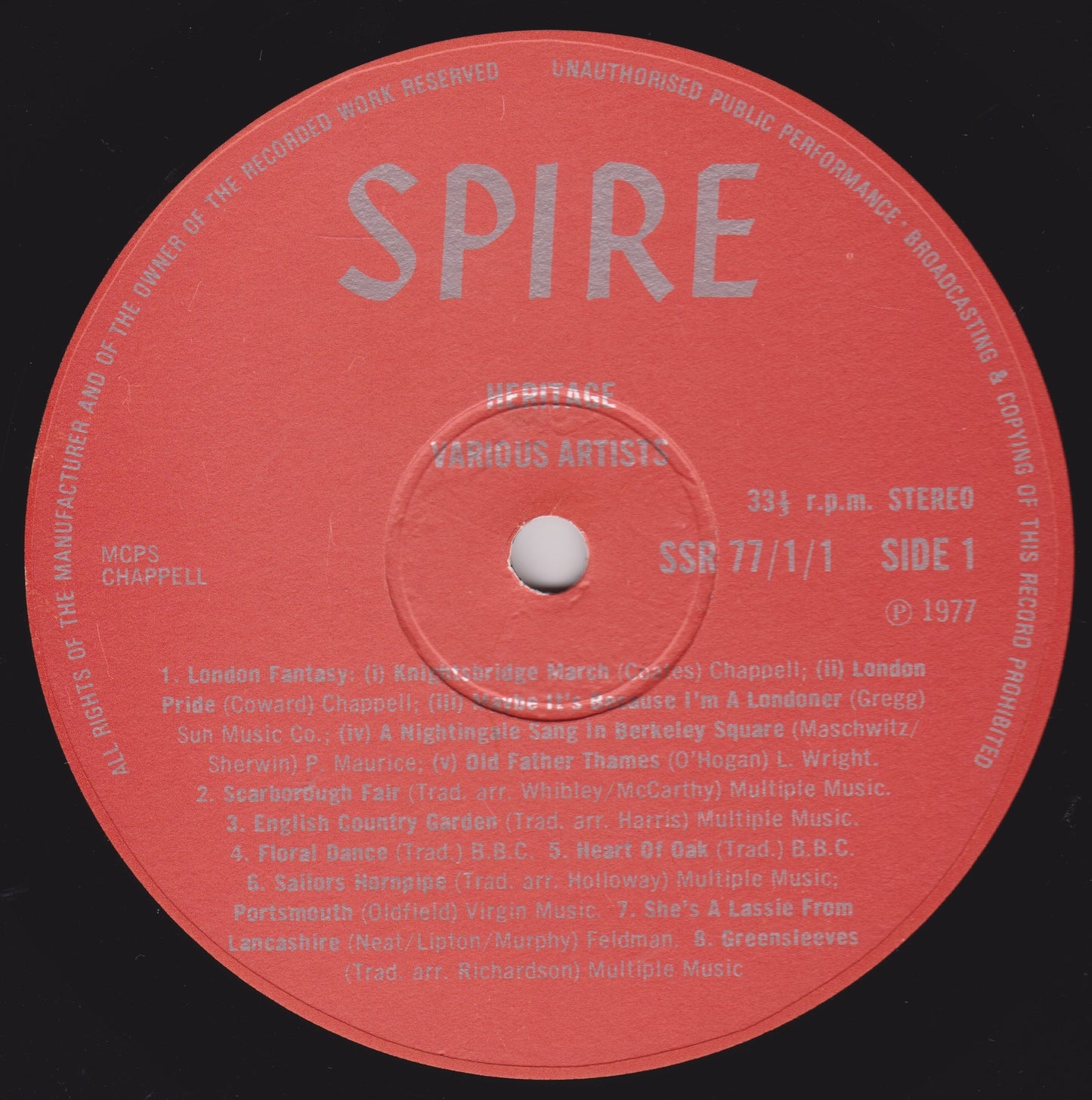 Red vinyl record label with 'SPIRE' branding and text on a black background