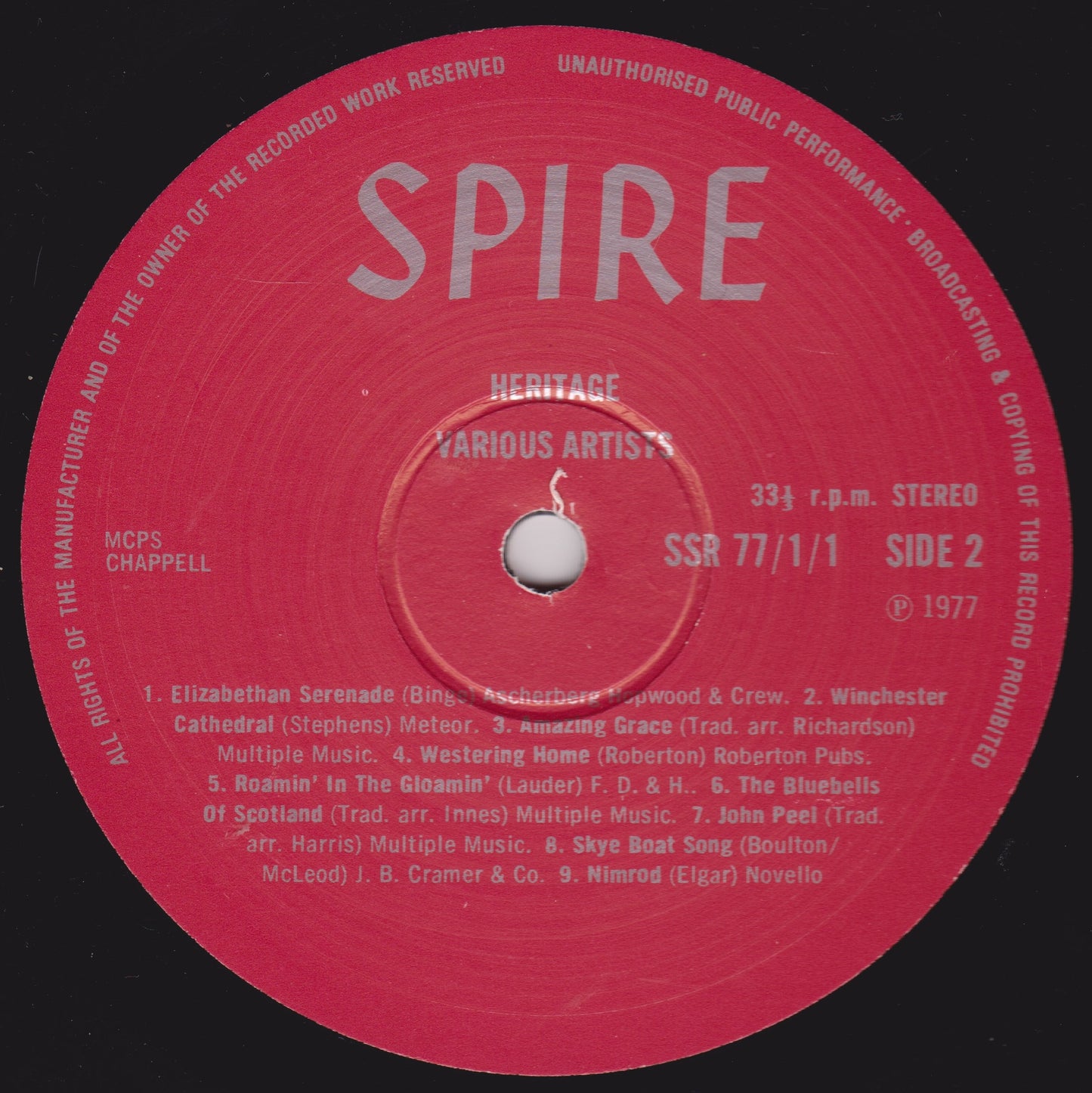Red vinyl record label with 'SPIRE' branding and text on a black background