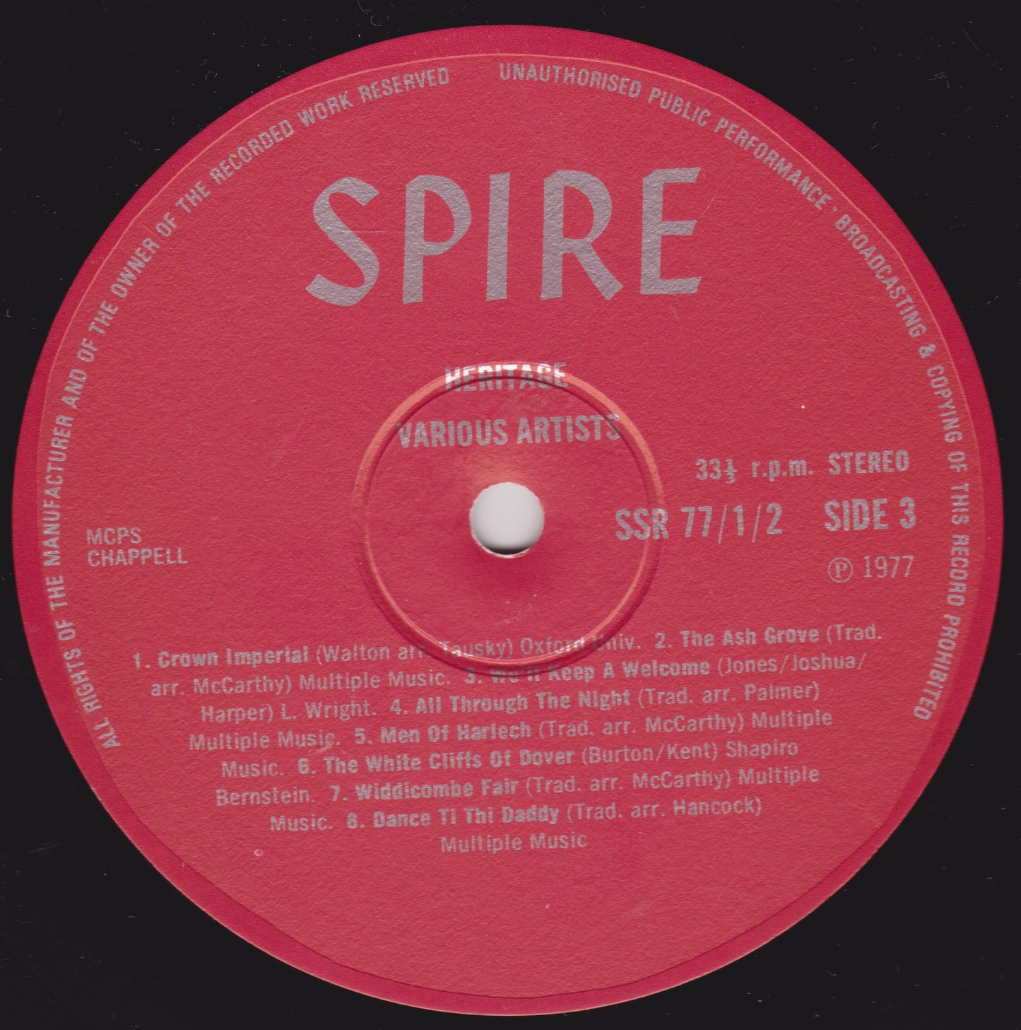 Red vinyl record label with 'Spire' branding and text on a black background