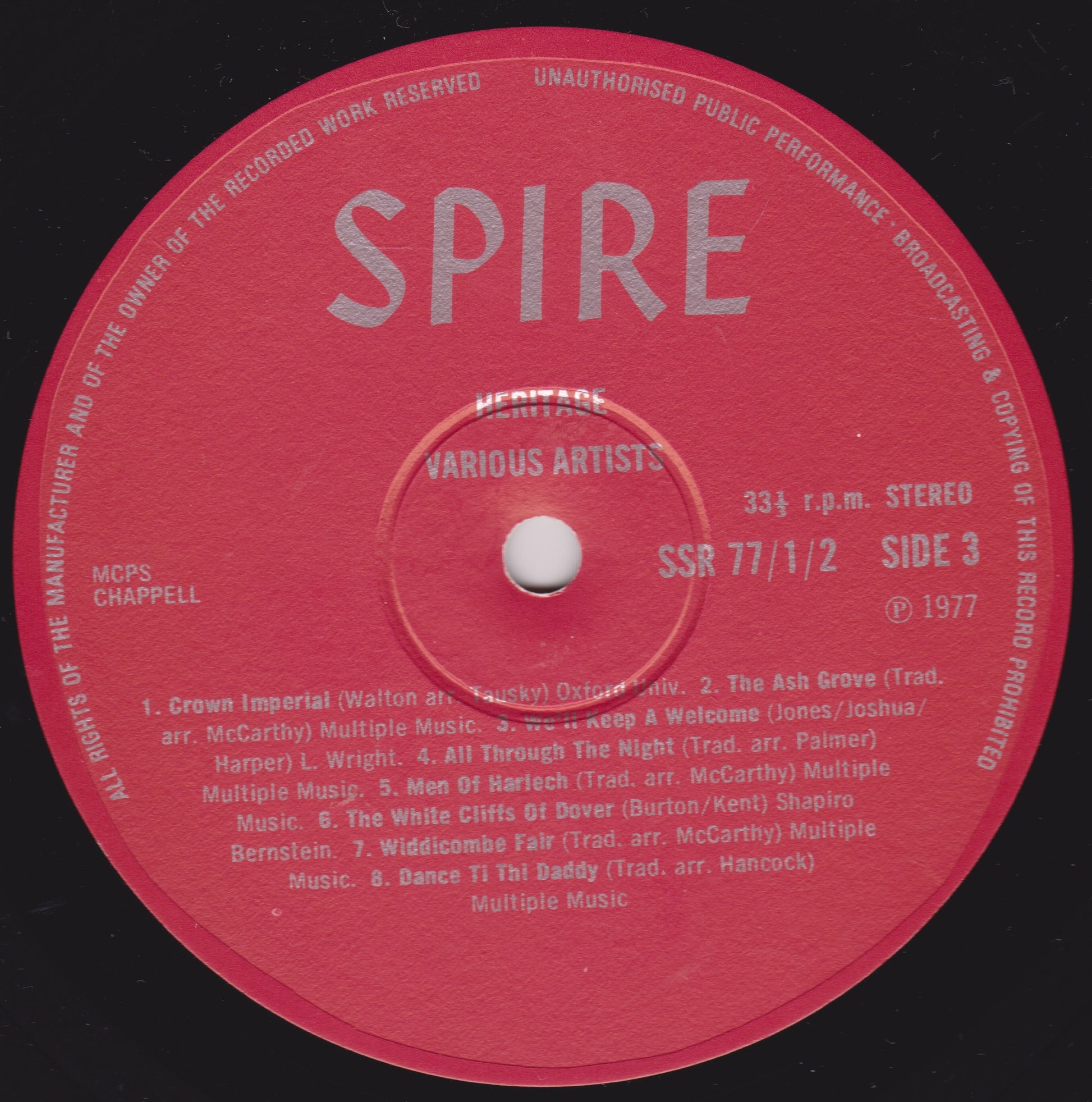Red vinyl record label with 'Spire' branding and text on a black background