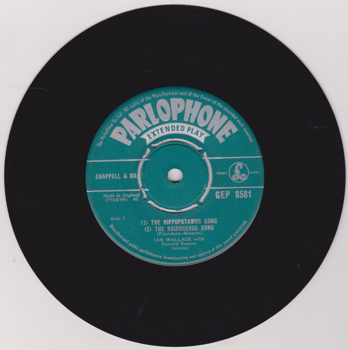 Parlophone extended play record label on a black vinyl record with a white background