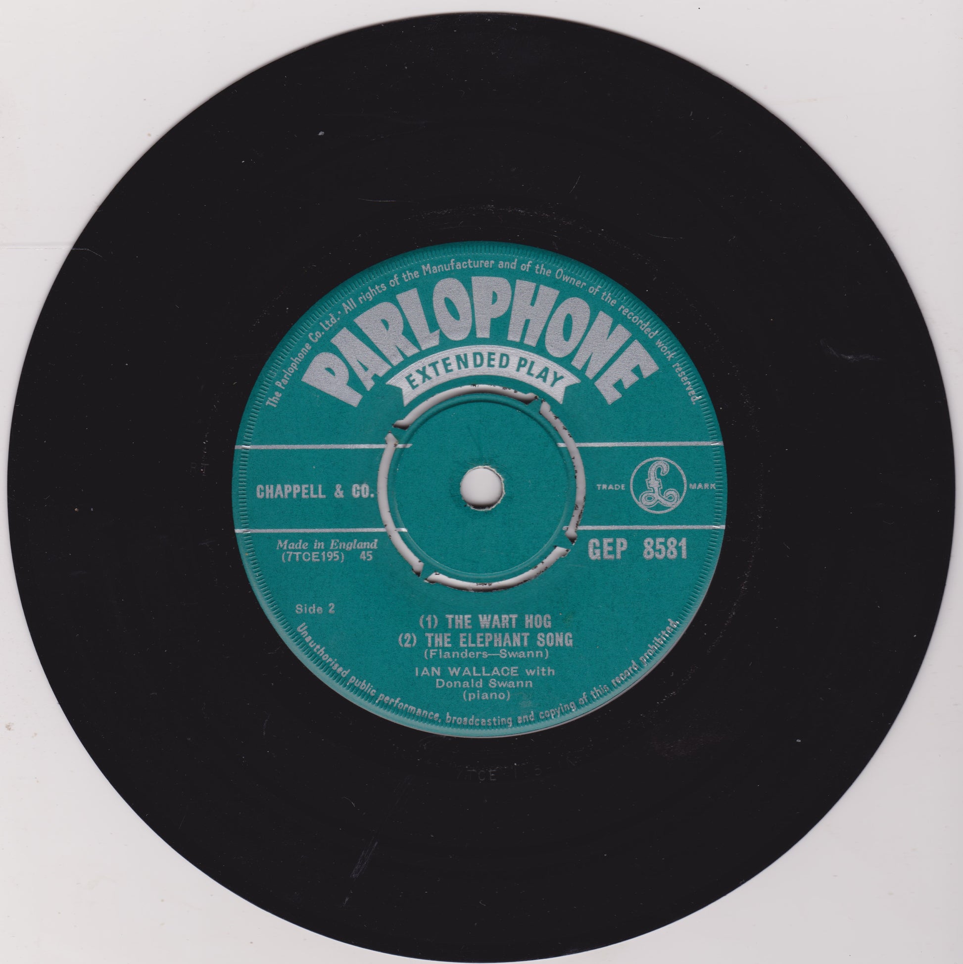 Parlophone extended play record label on a black vinyl record with a white background