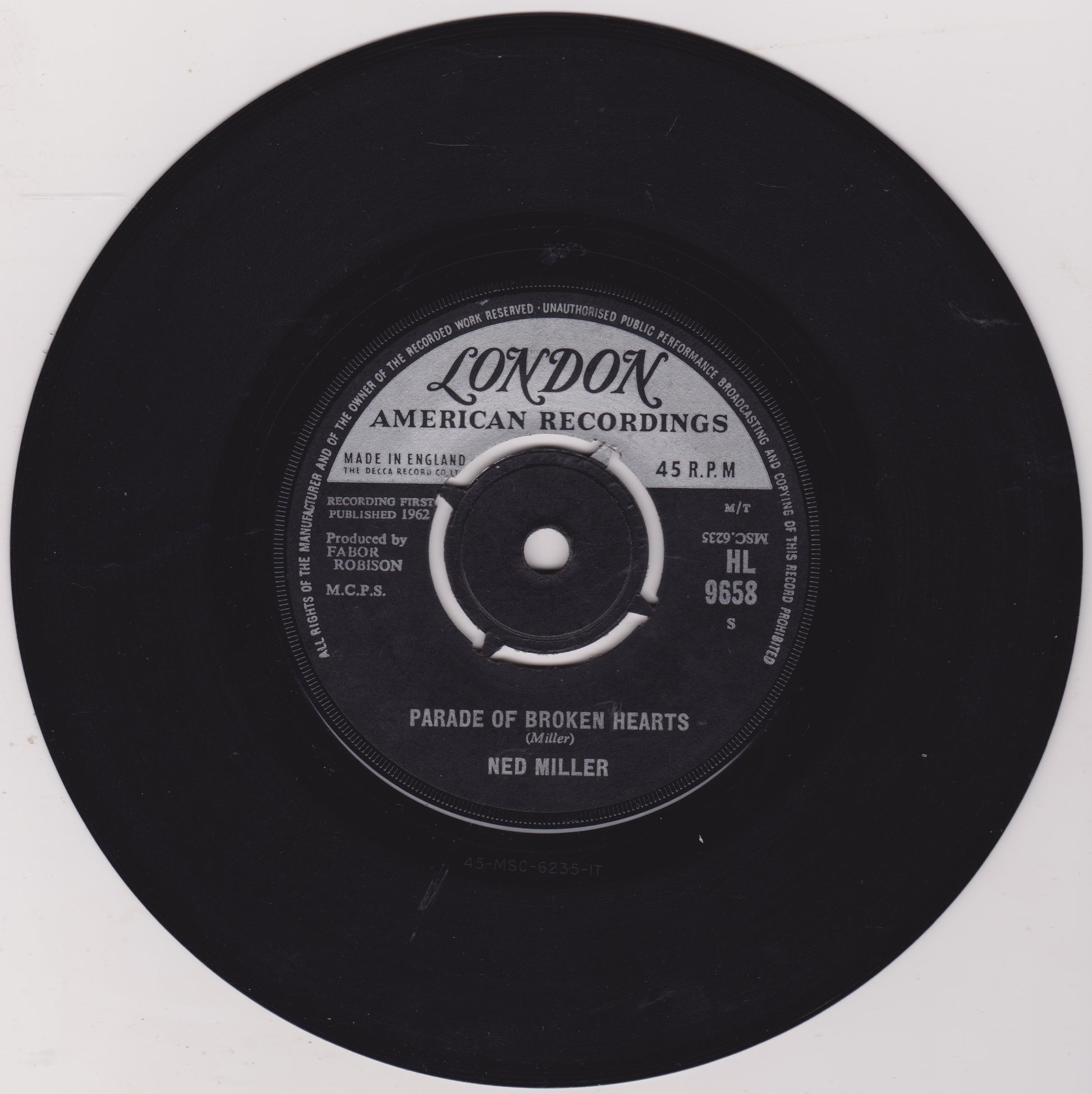 Black vinyl record with 'London American Recordings' label on a white background