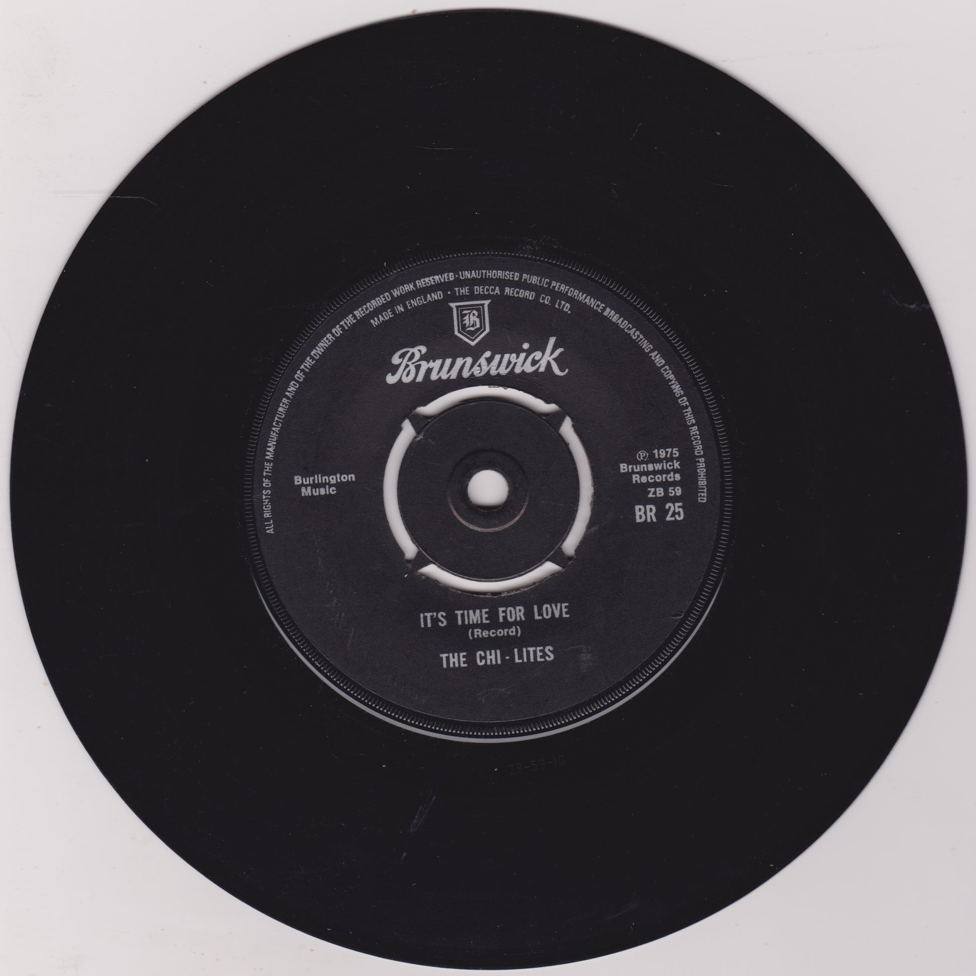 Black vinyl record with 'Brunswick' label on a white background