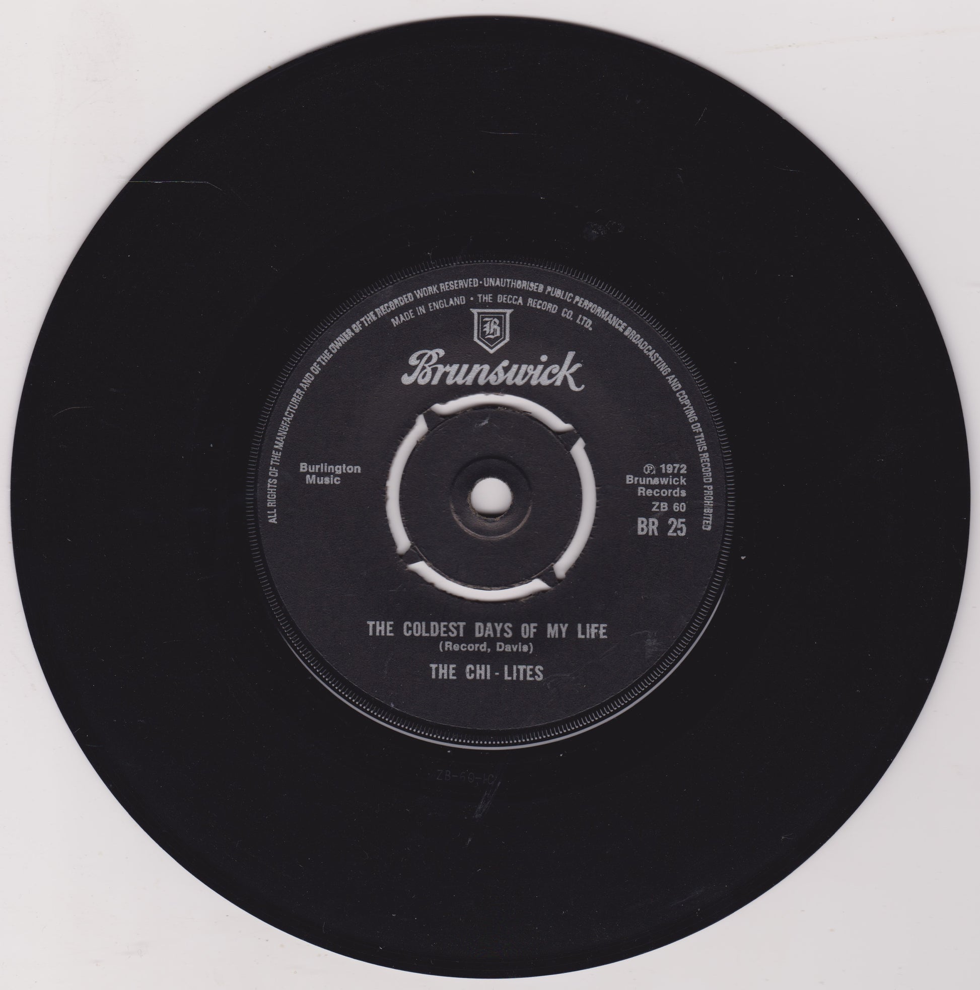 Black vinyl record with 'Brunswick' label on a white background