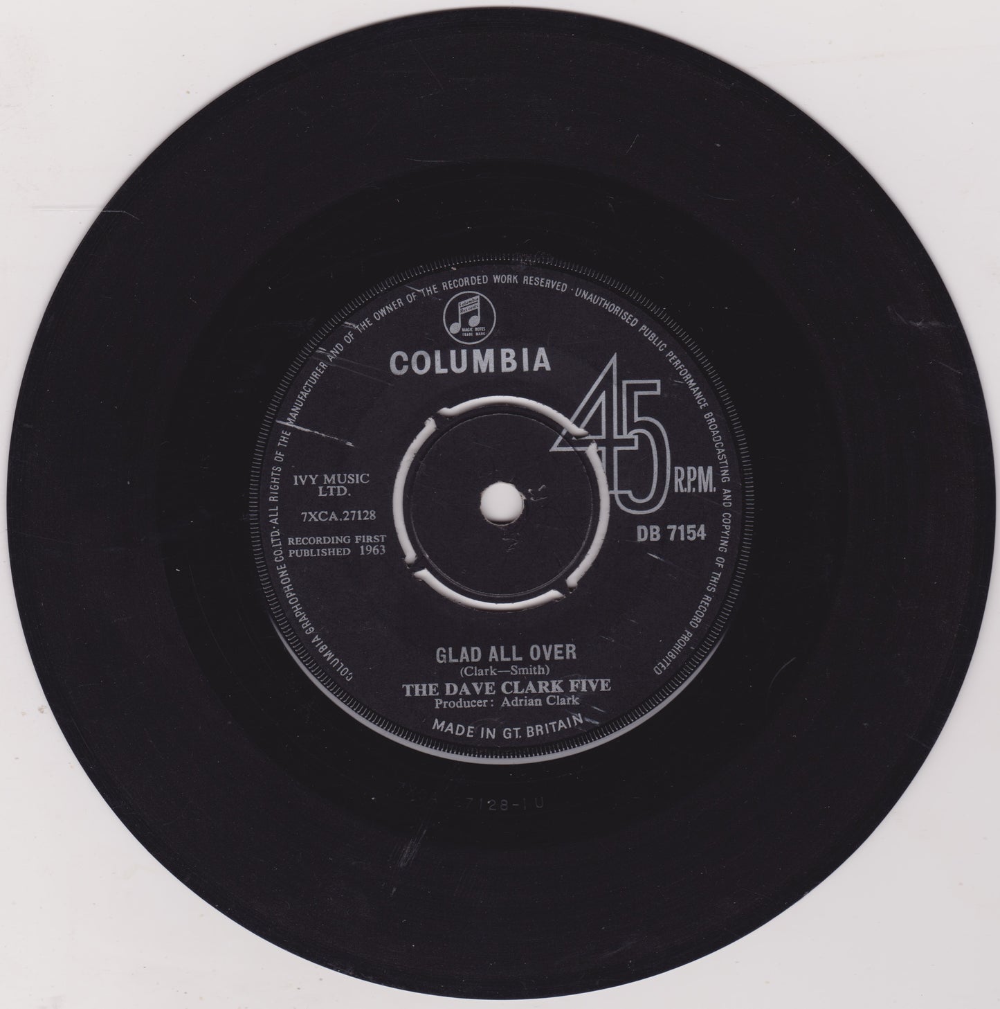 Vinyl record with Columbia label and 'Glad All Over' by The Dave Clark Five on a white background