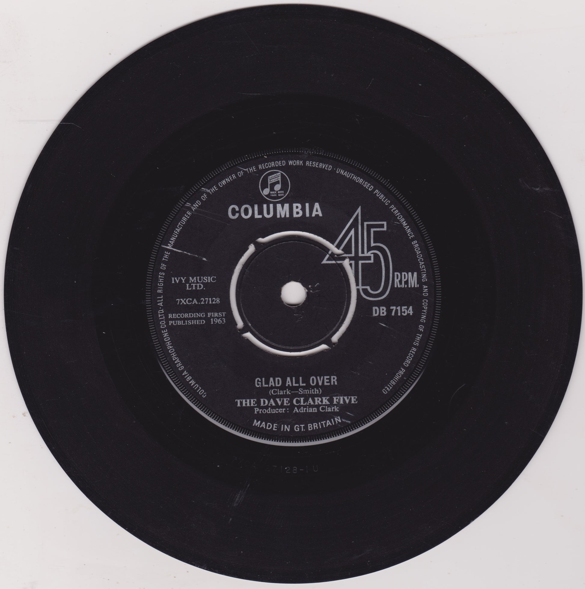 Vinyl record with Columbia label and 'Glad All Over' by The Dave Clark Five on a white background