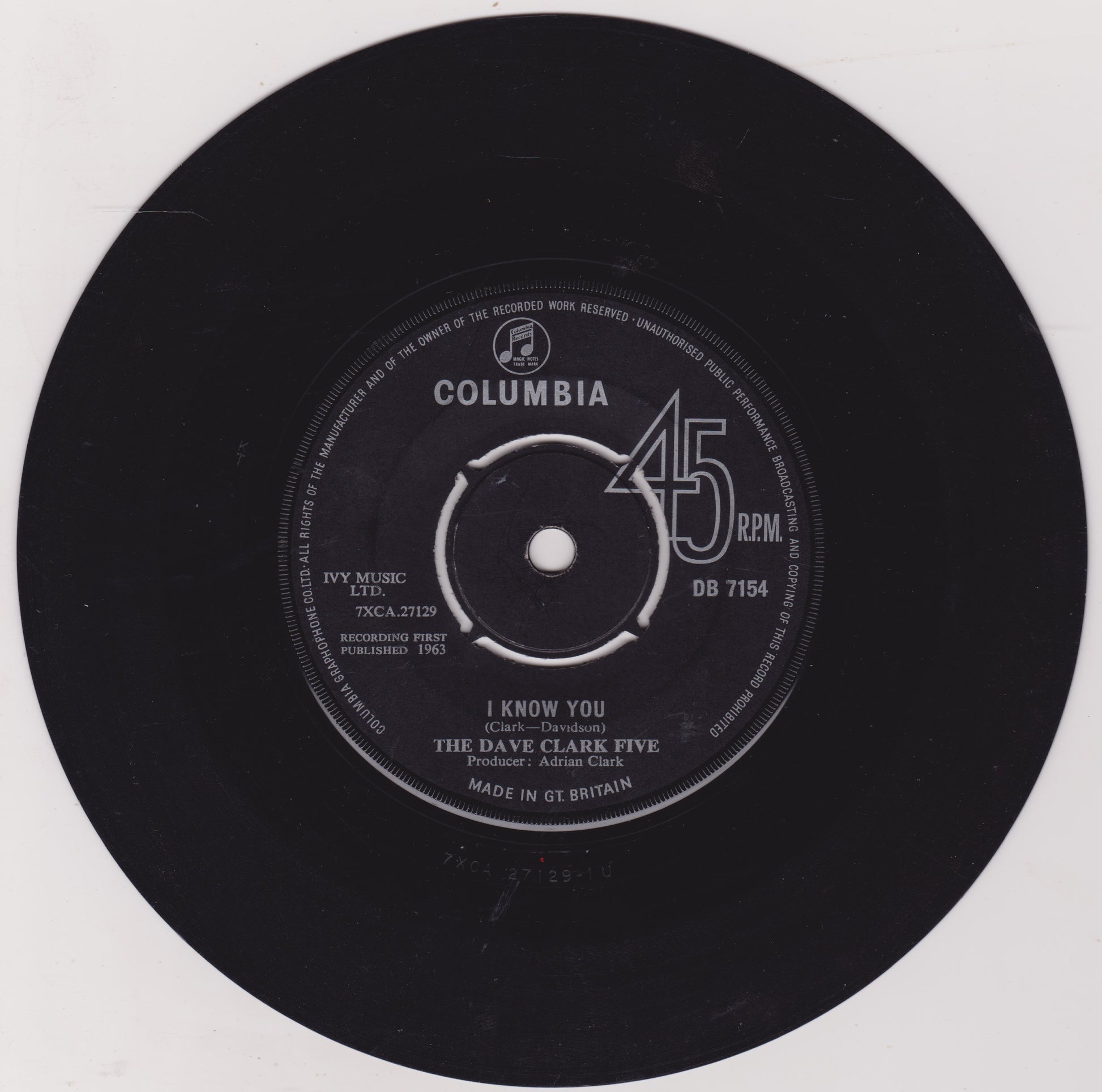 Black vinyl record with Columbia label and 'I Know You' by The Dave Clark Five on a white background