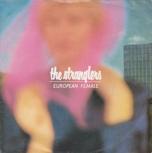 Single cover for 'European Female' by The Stranglers with a blurred figure and building in the background.