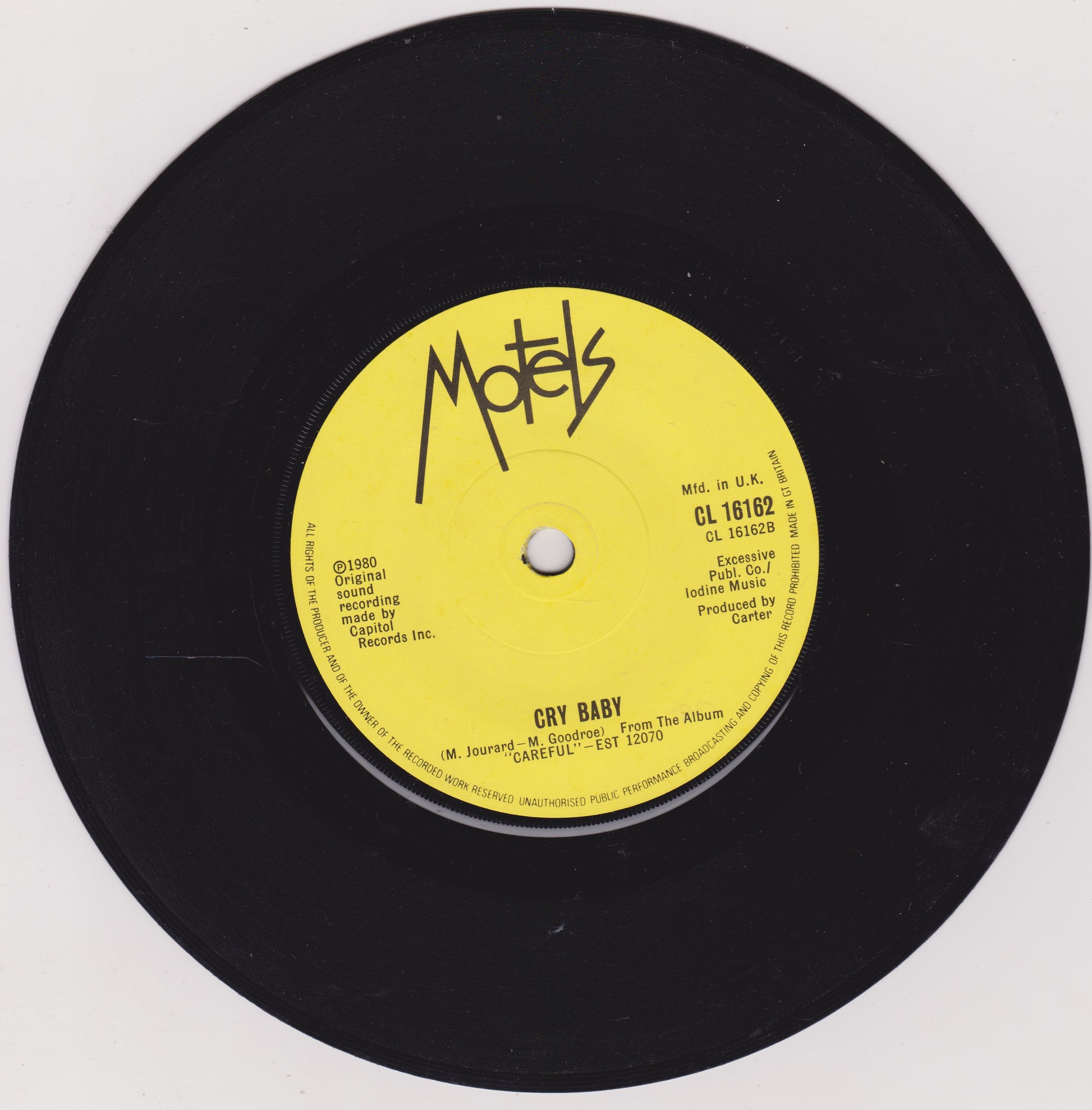 Vinyl record with yellow label featuring 'Motels' on a white background