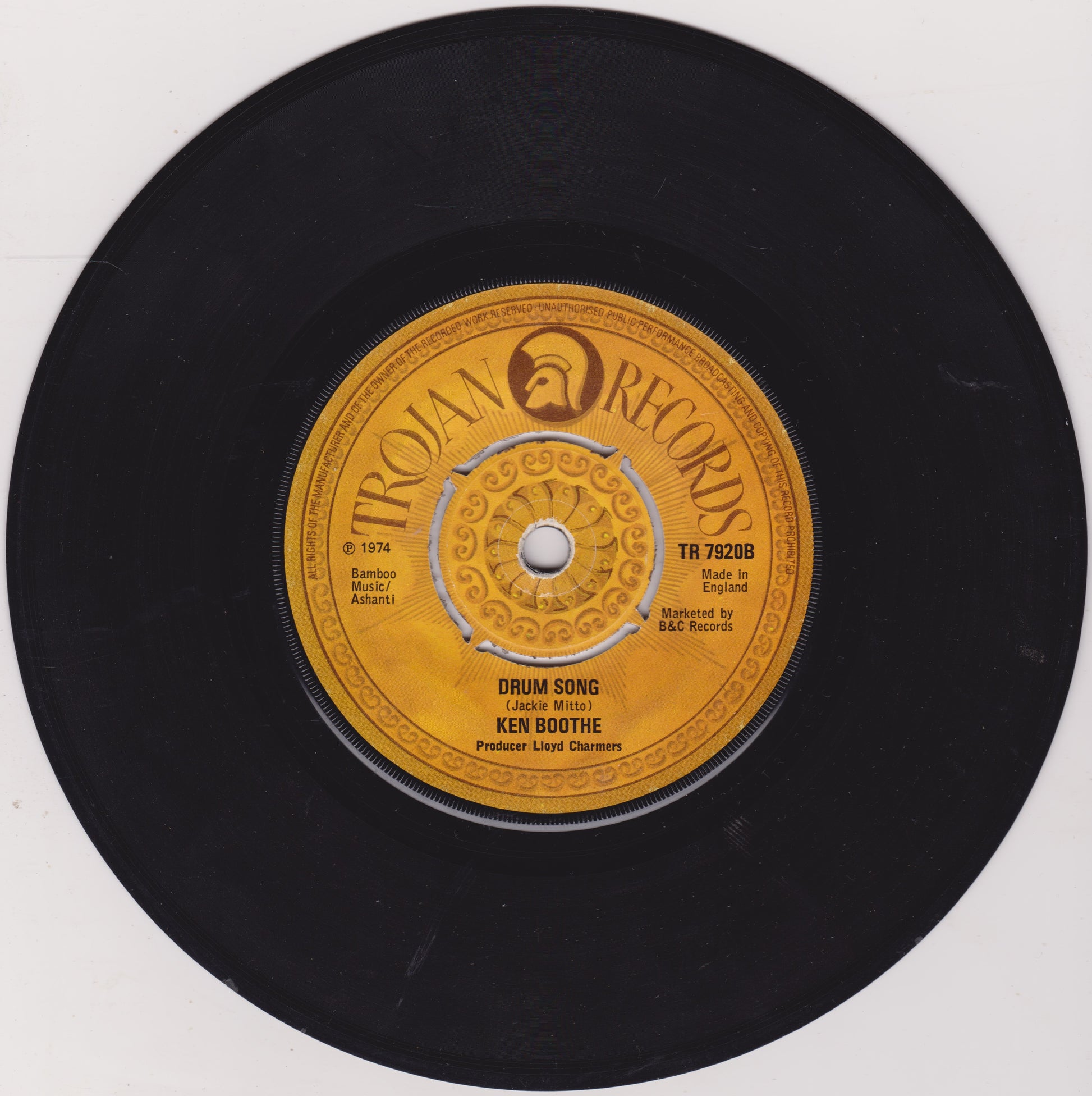 Black vinyl record with Trojan Records label on a white background