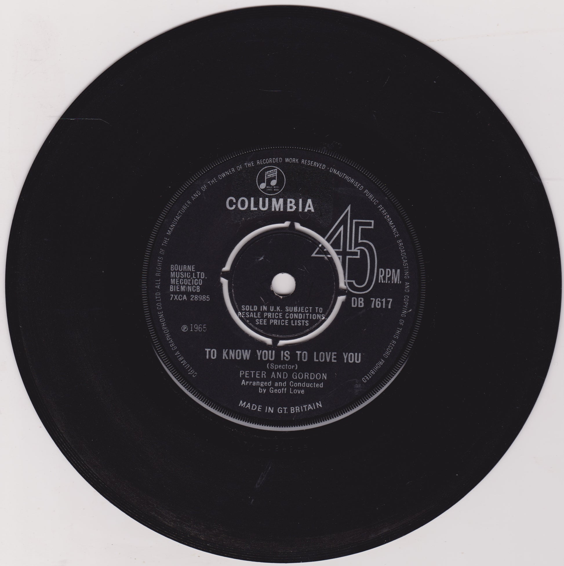 Black vinyl record with Columbia label on a white background