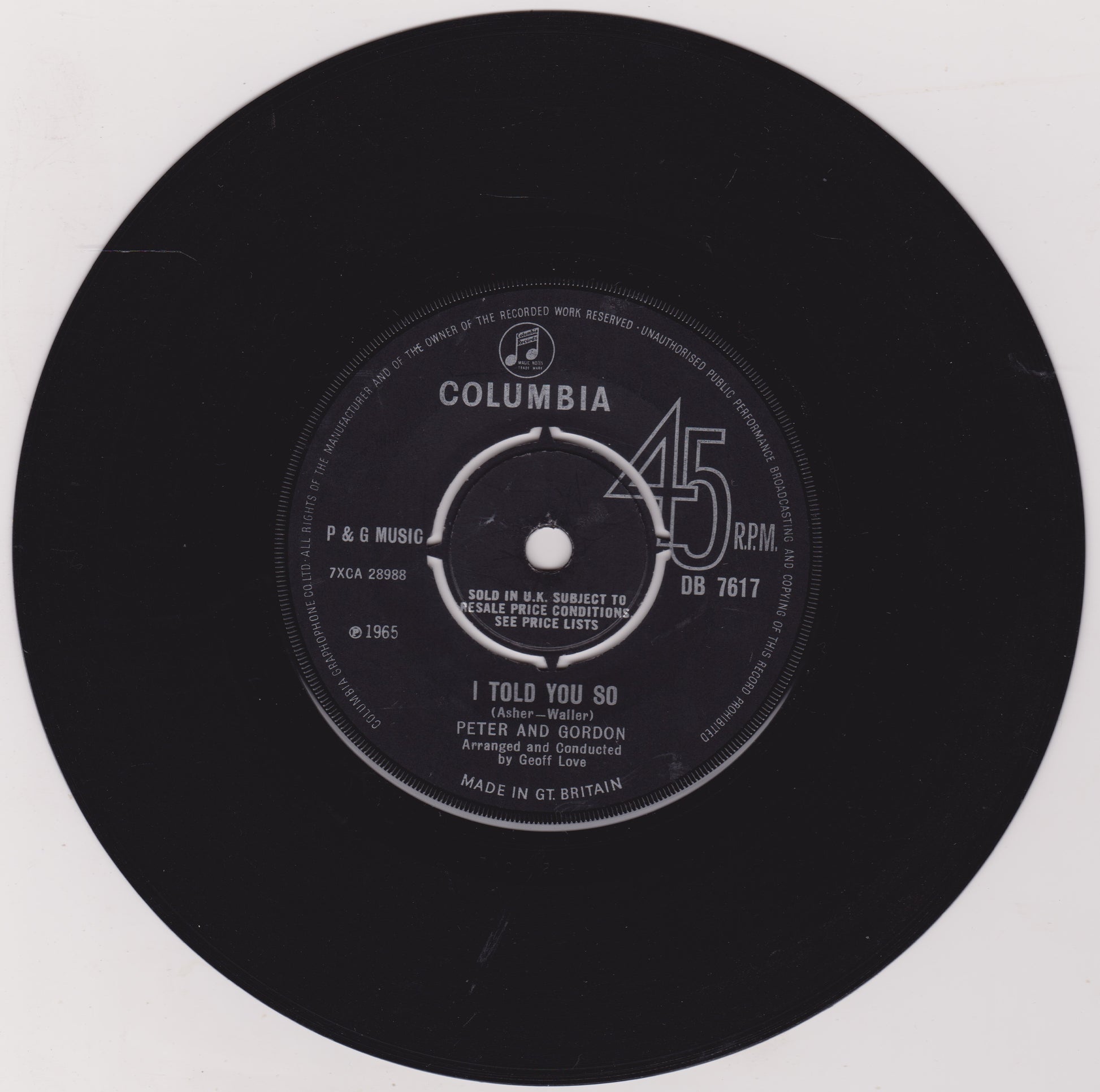 Black vinyl record label with 'Columbia' branding and song details on a white background