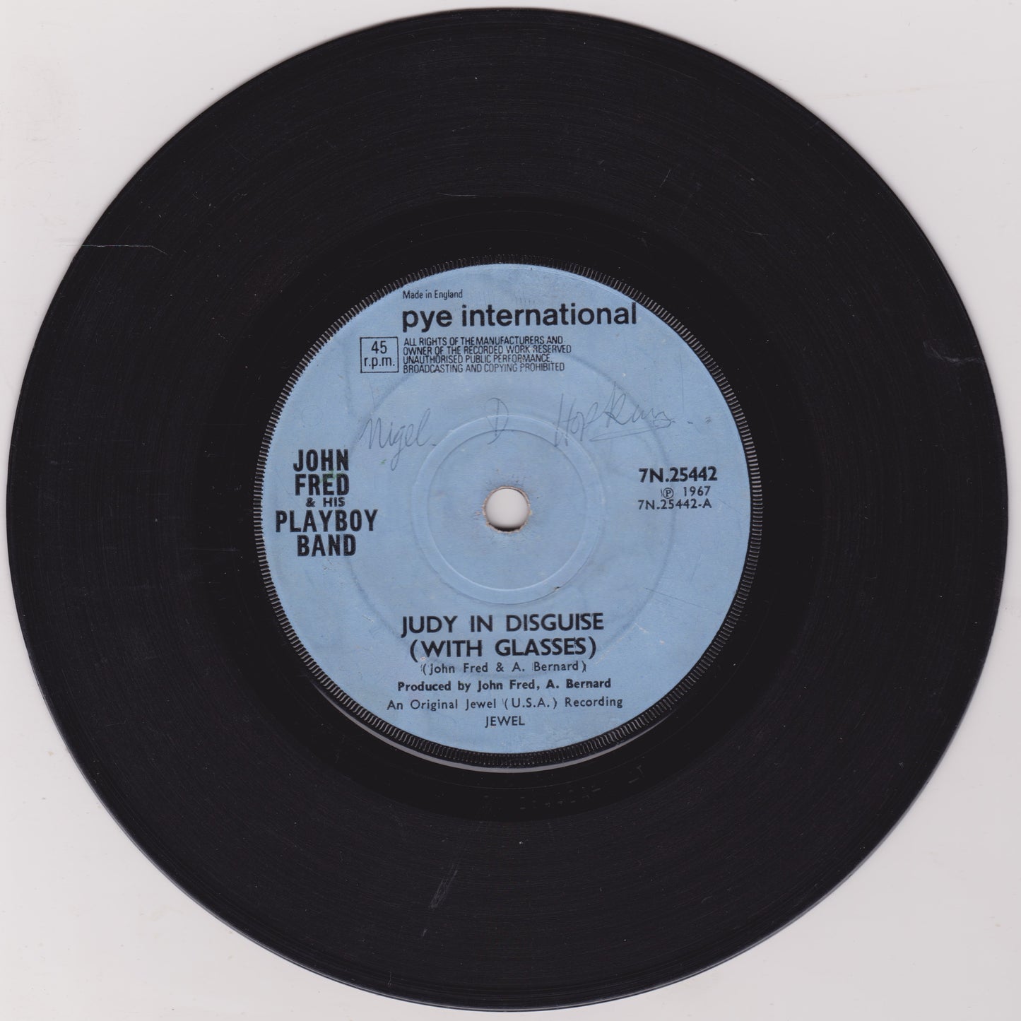 Vinyl record with 'John Fred Playboy Band' on a white background