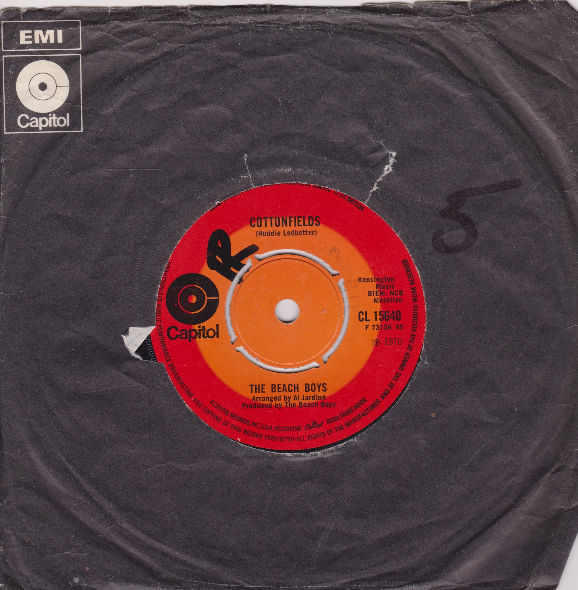 Vinyl record with red label featuring 'The Beach Boys' on a black background