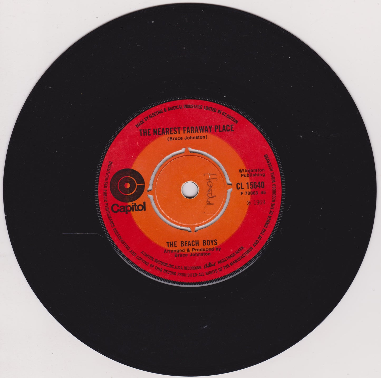 Vinyl record with red label featuring 'The Beach Boys' on a white background