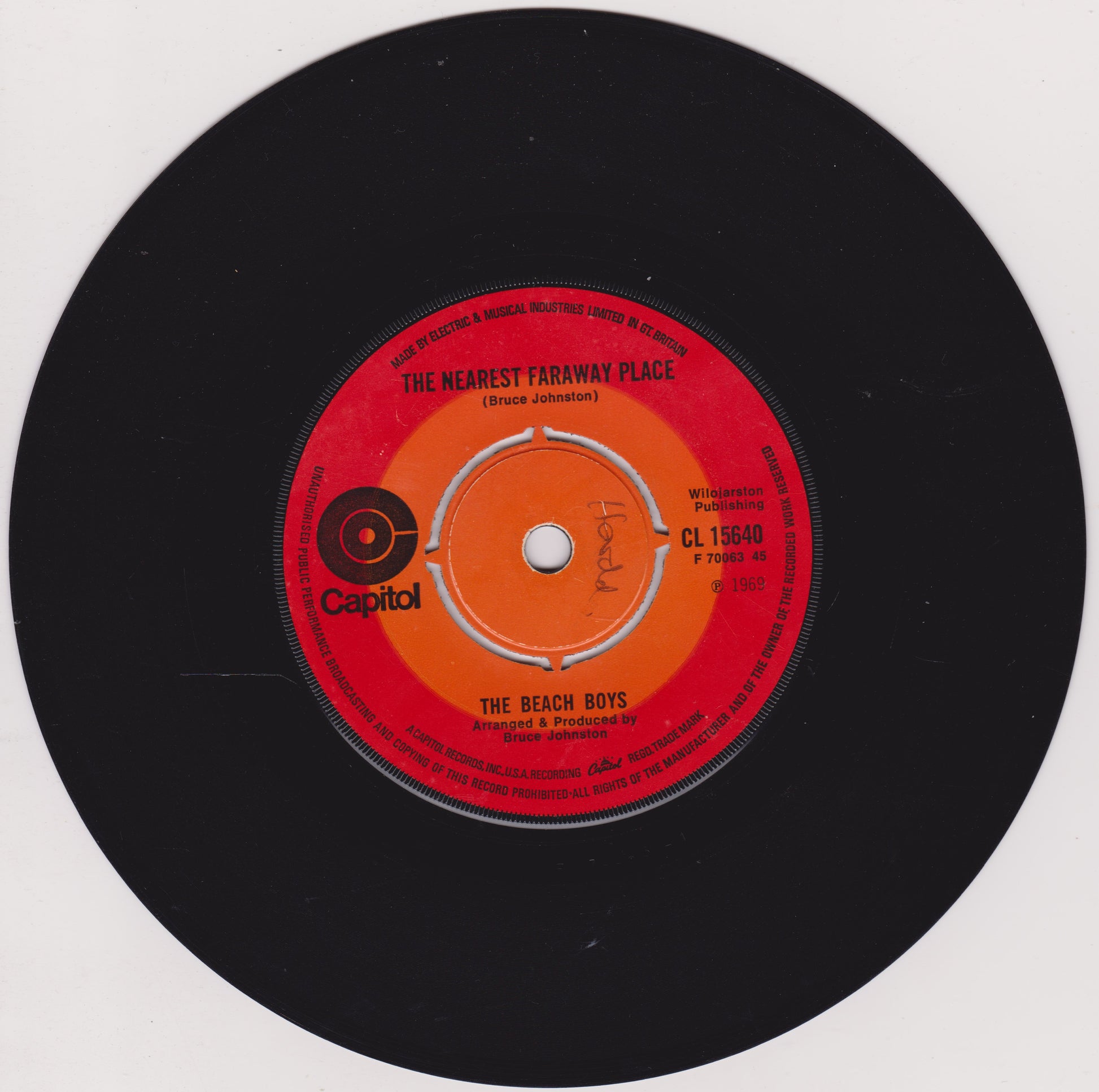 Vinyl record with red label featuring 'The Beach Boys' on a white background