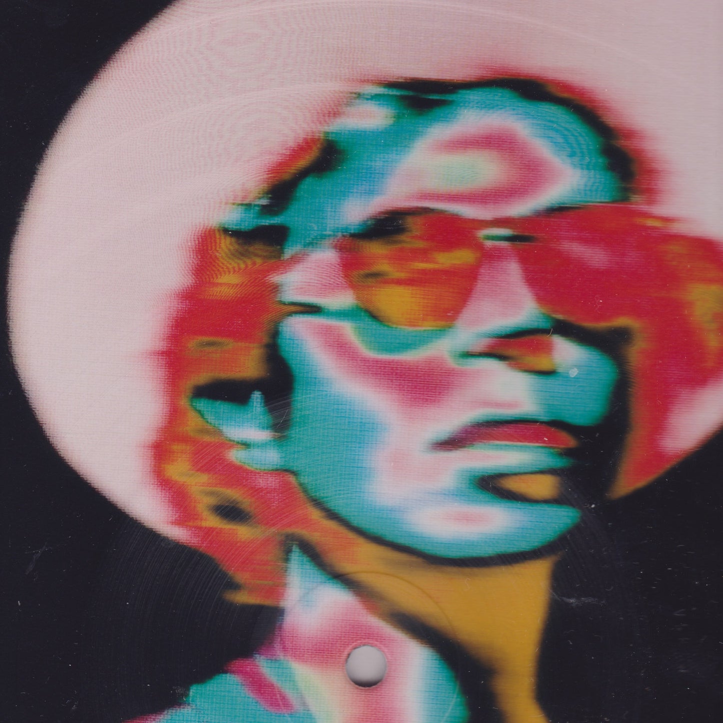 Colorful tie-dye design on a hat with a black background