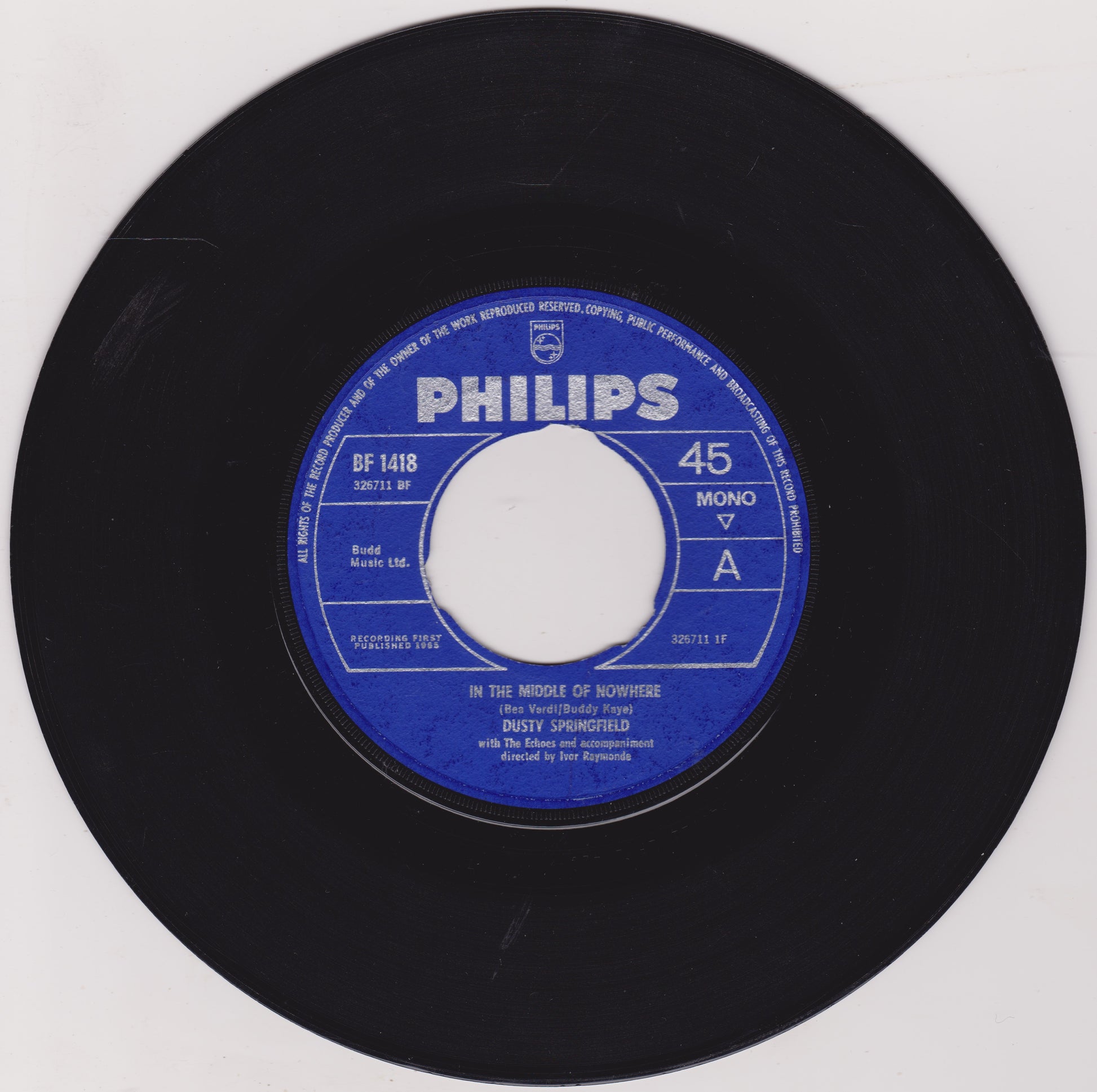 Black vinyl record with a blue Philips label on a white background