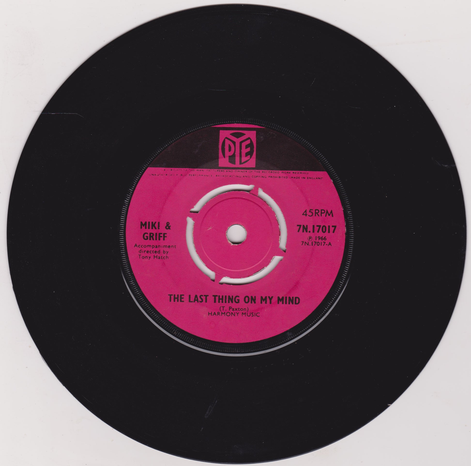 Vinyl record with pink label on a white background