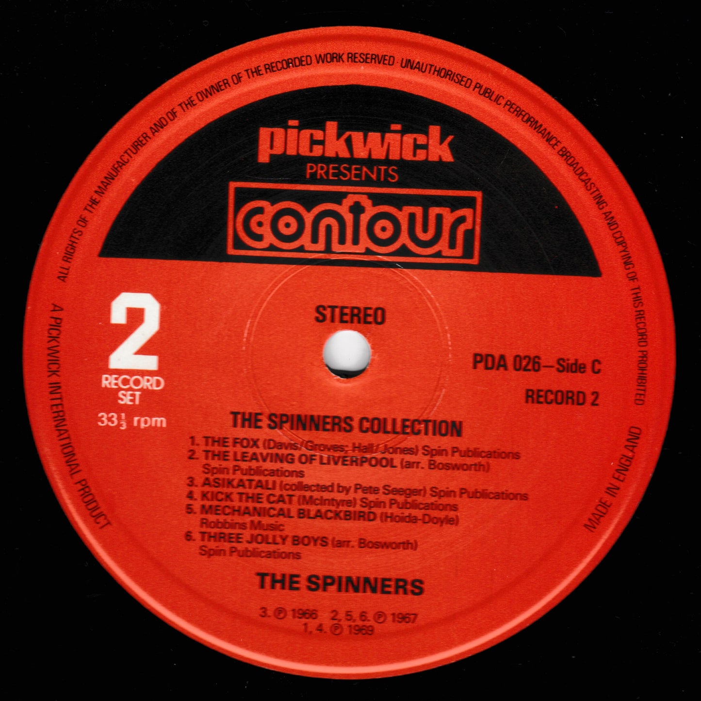 Red record label with 'Pickwick' and 'Contour' branding, featuring a list of songs by The Spinners.