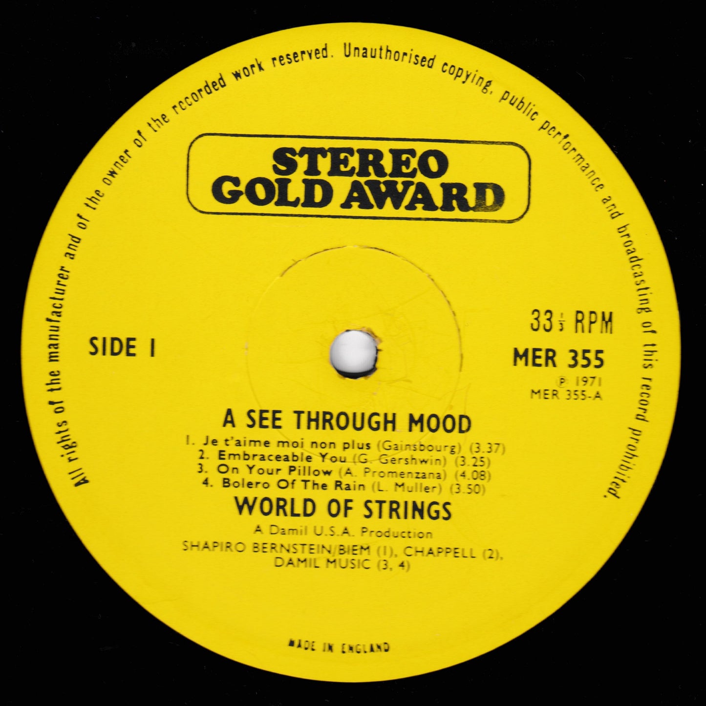 Yellow record label with text and music track details on a black background