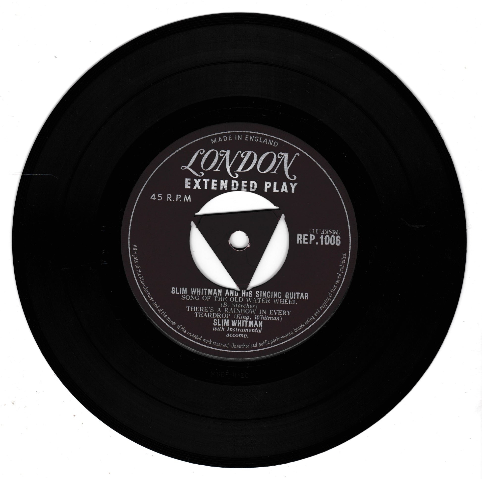 A black 45 RPM vinyl record with a central label for London Extended Play, featuring Slim Whitman's 'There's No One To Judge'.