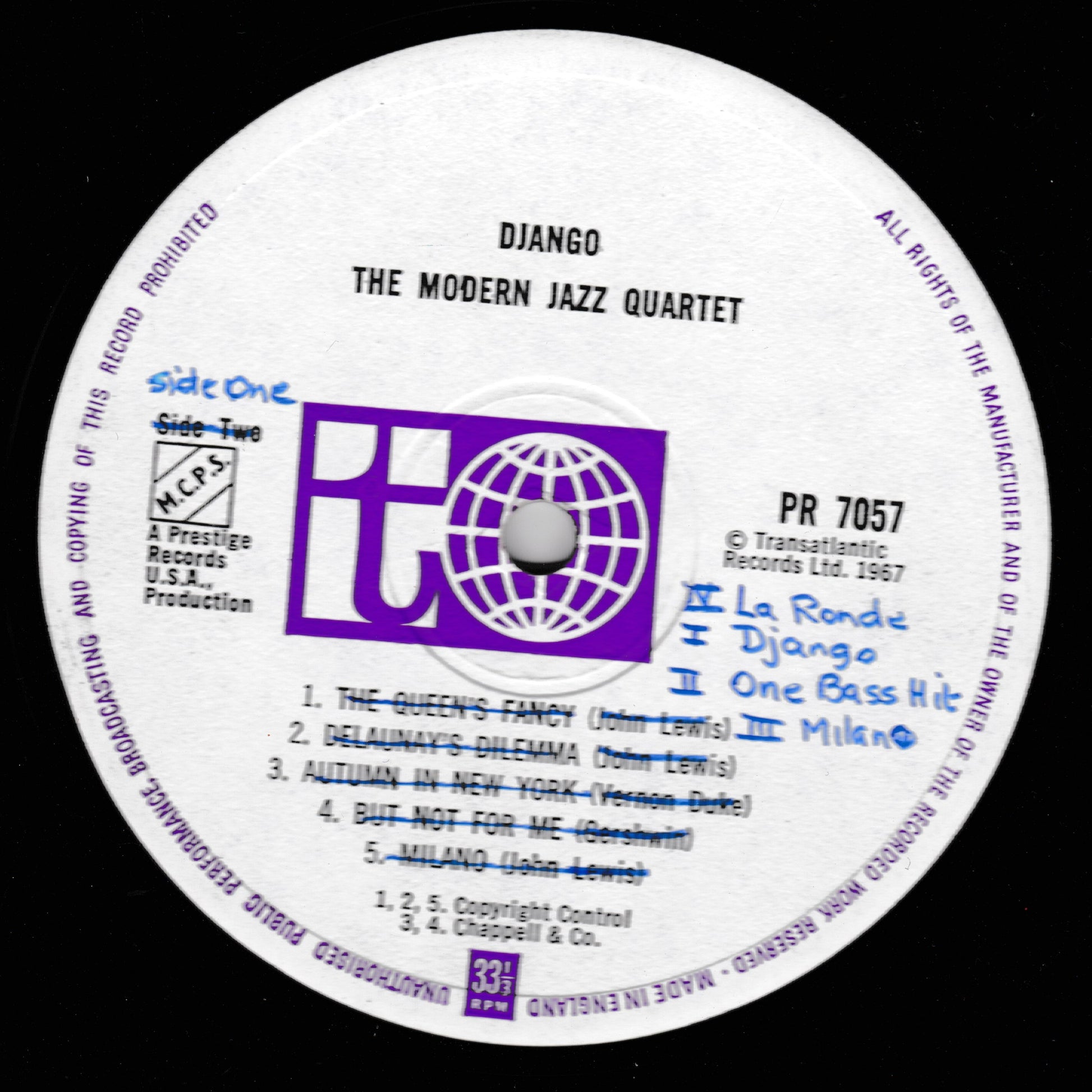 A close-up of a vinyl record label for Django - The Modern Jazz Quartet, showing the record label logo, track listing, and handwritten track additions on a black background.