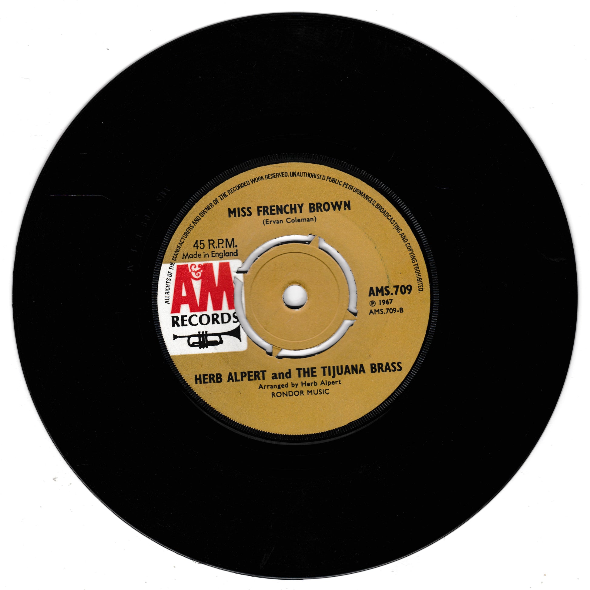 Record with AM Records label featuring 'Miss Frenchy Brown' by Herb Alpert and the Tijuana Brass.