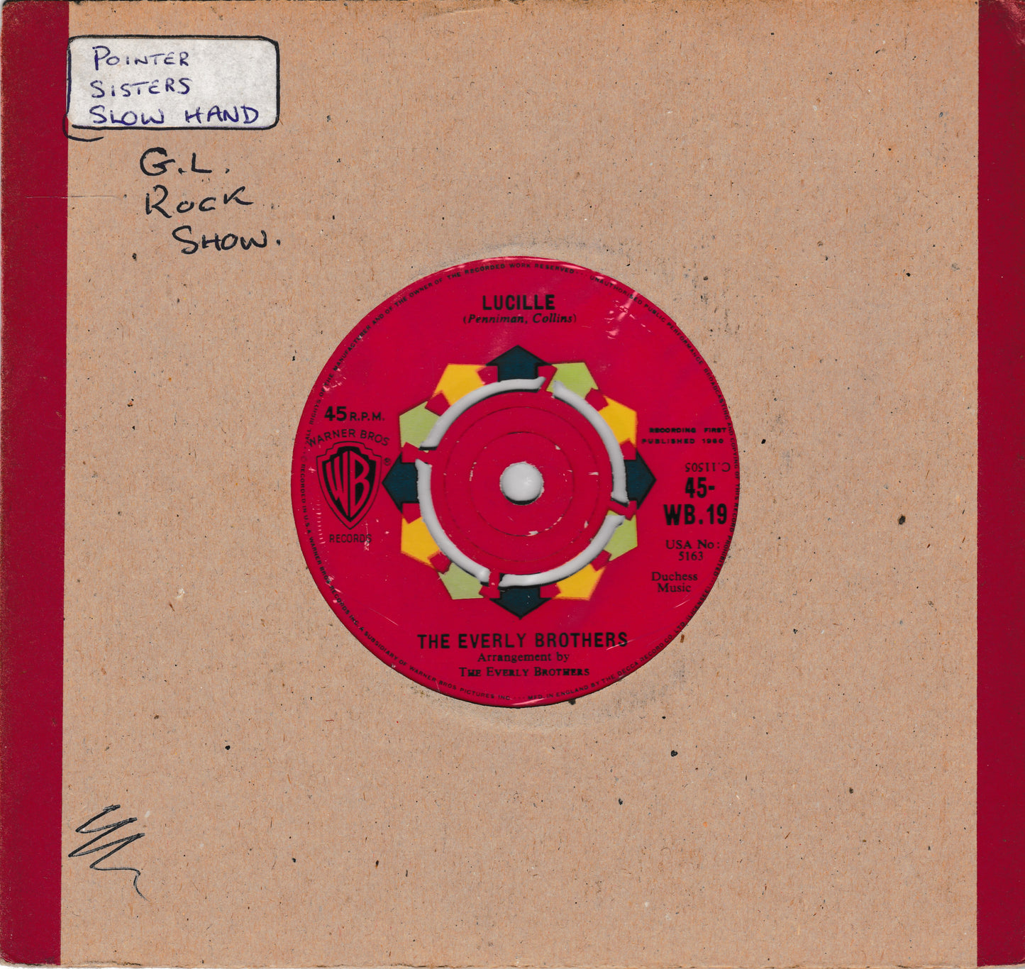 A vintage 45 single record sleeve for 'Ludille' by The Everly Brothers, featuring a bright red vinyl disc centered on a tan cardboard cover with red side borders. Handwritten notes are visible in the top left corner.