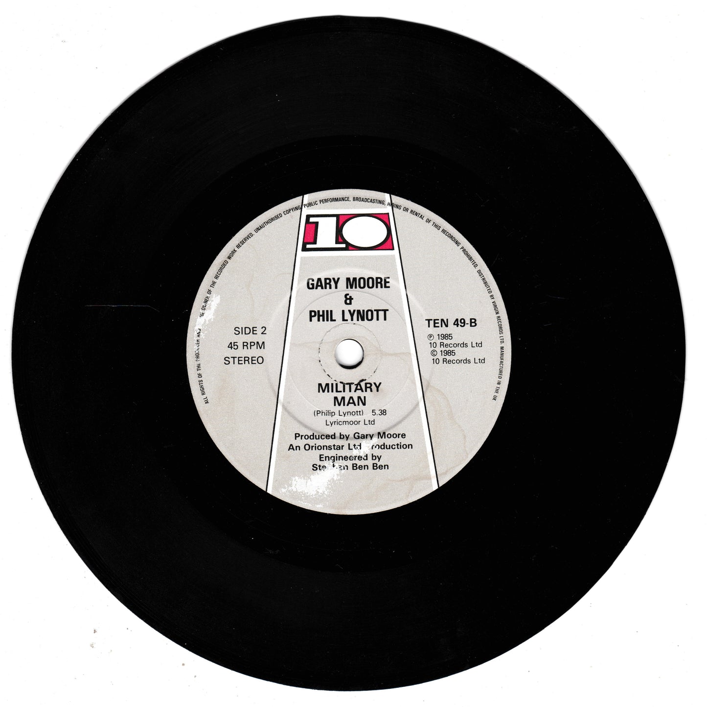 A black vinyl record with a white centre label featuring the text 'GARY MOORE & PHIL LYNOTT' and the title 'MILITARY MAN', photographed on a plain white background.