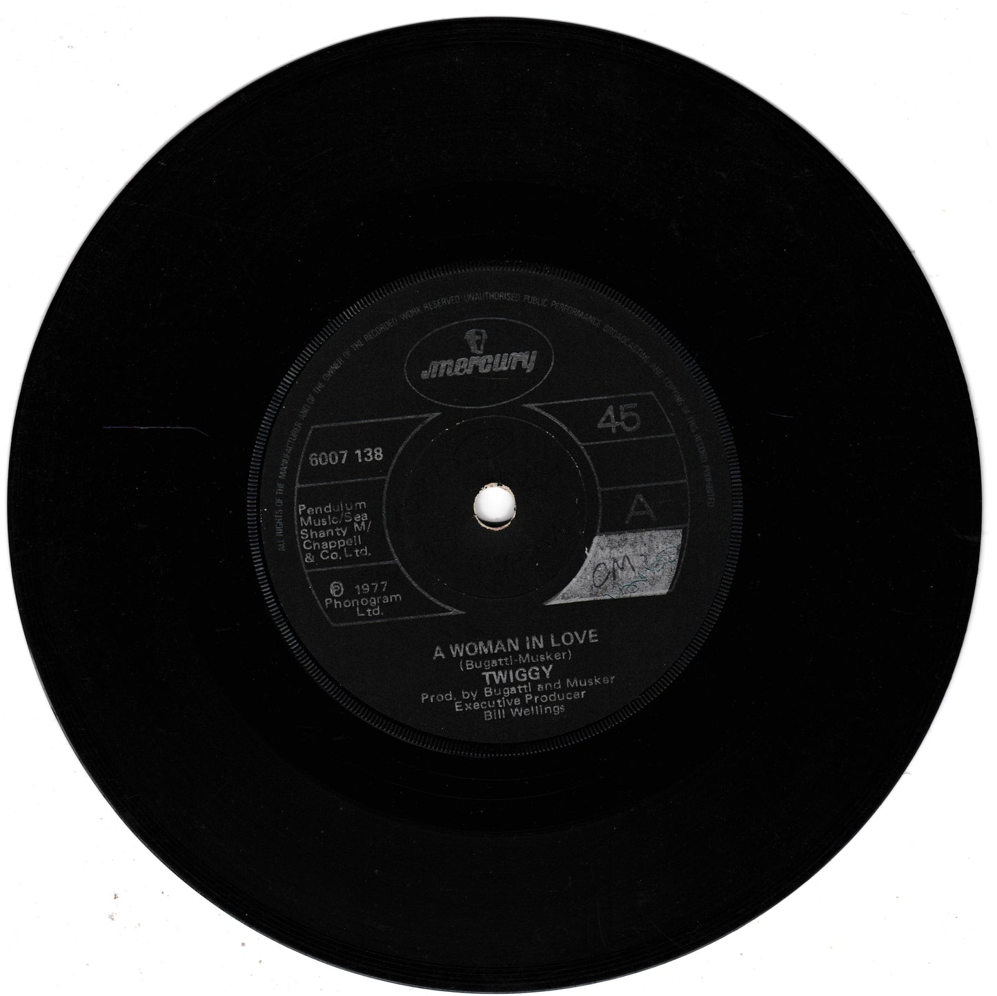 A black 45 RPM vinyl record with a central label for Twiggy's 'A Woman in Love' produced by Bob Neel, featuring the Anspach label.